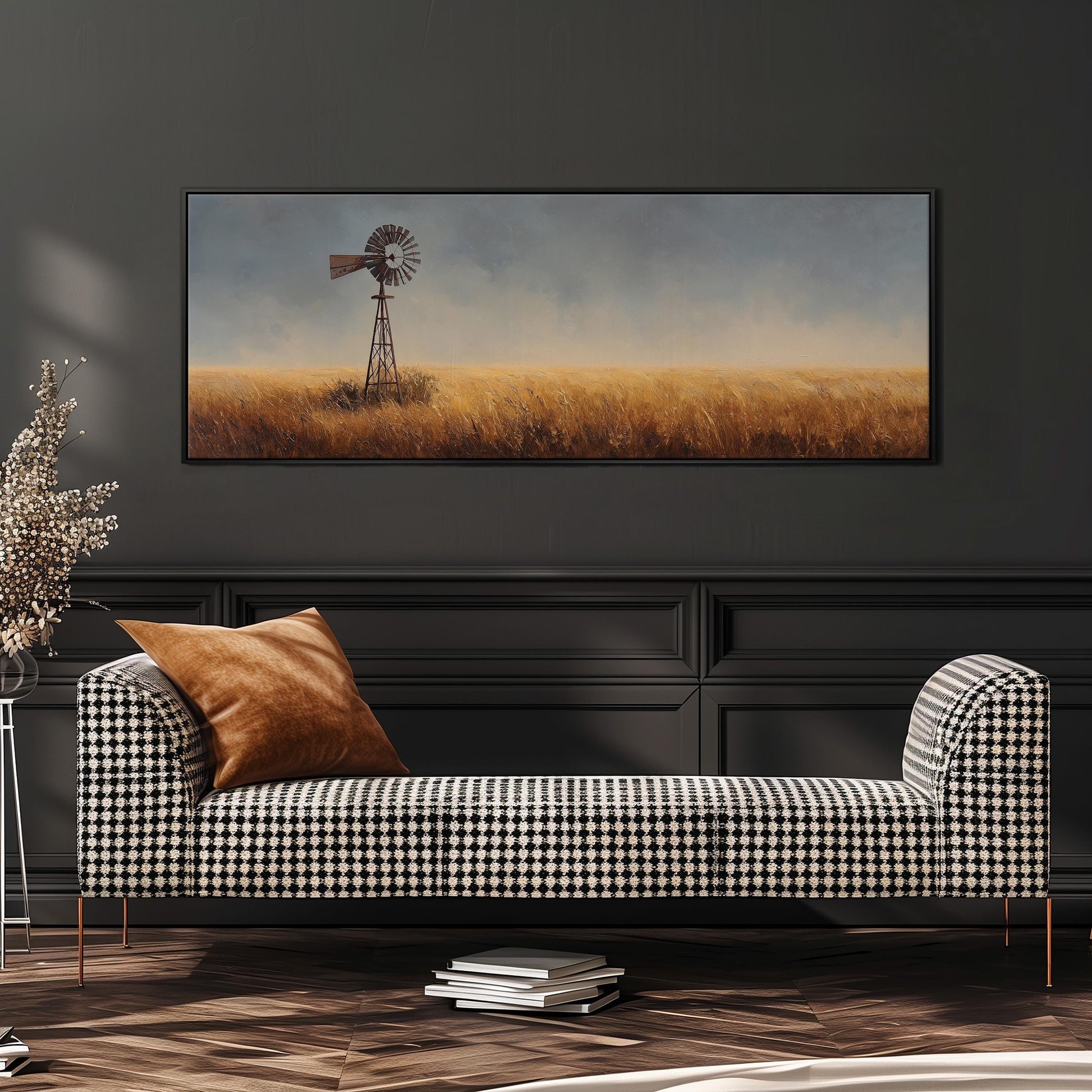 a checkered sofa with a brown throw pillow, set against a dark wall with a large painting of a windmill in the background.