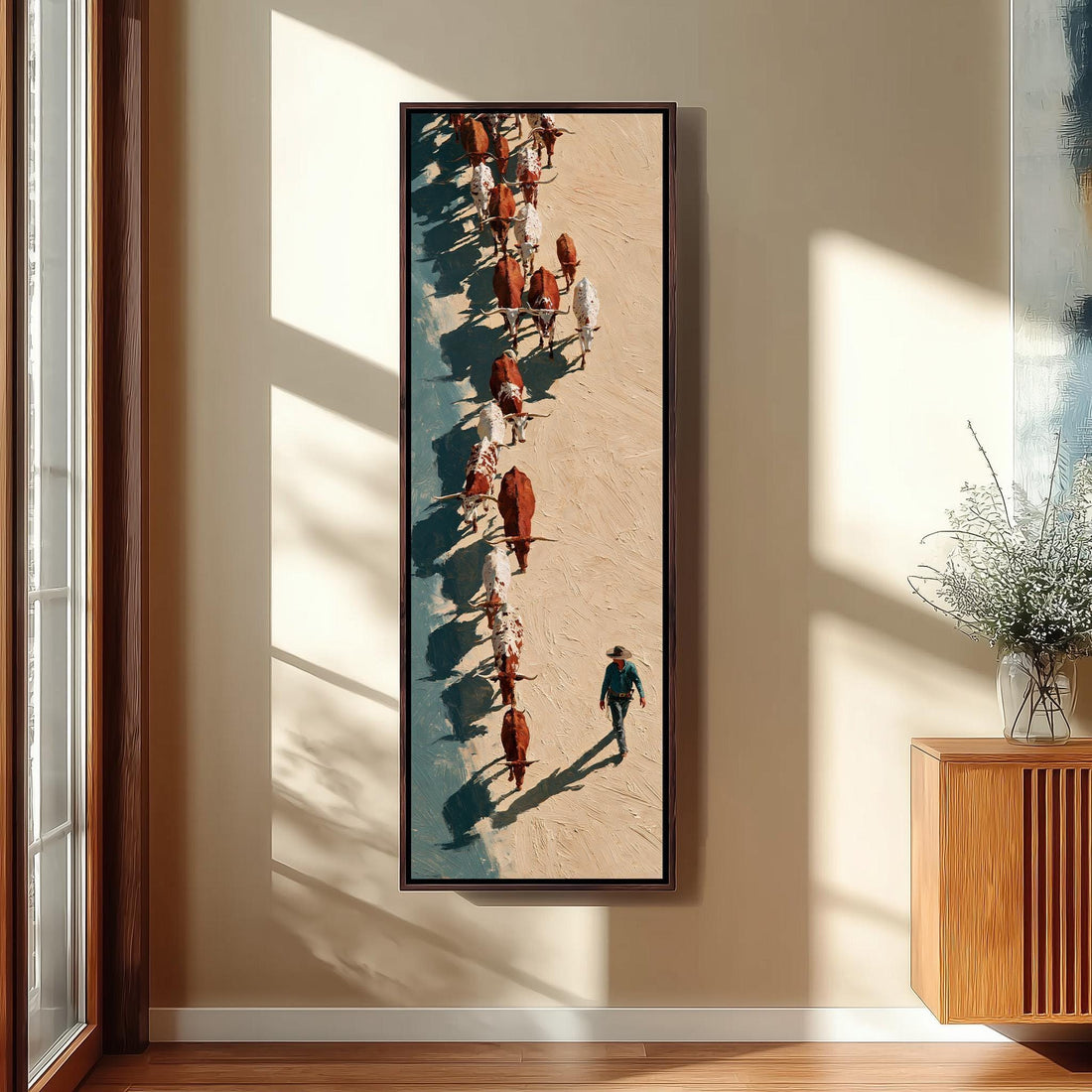 Cattle drive seen from above long vertical canvas print in a sunlit living space