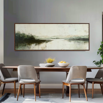 a dining room with a large painting of a landscape hanging on the wall above a wooden dining table with four chairs. The table is set with a bowl of fruit and a vase of flowers, creating a cozy and inviting atmosphere.