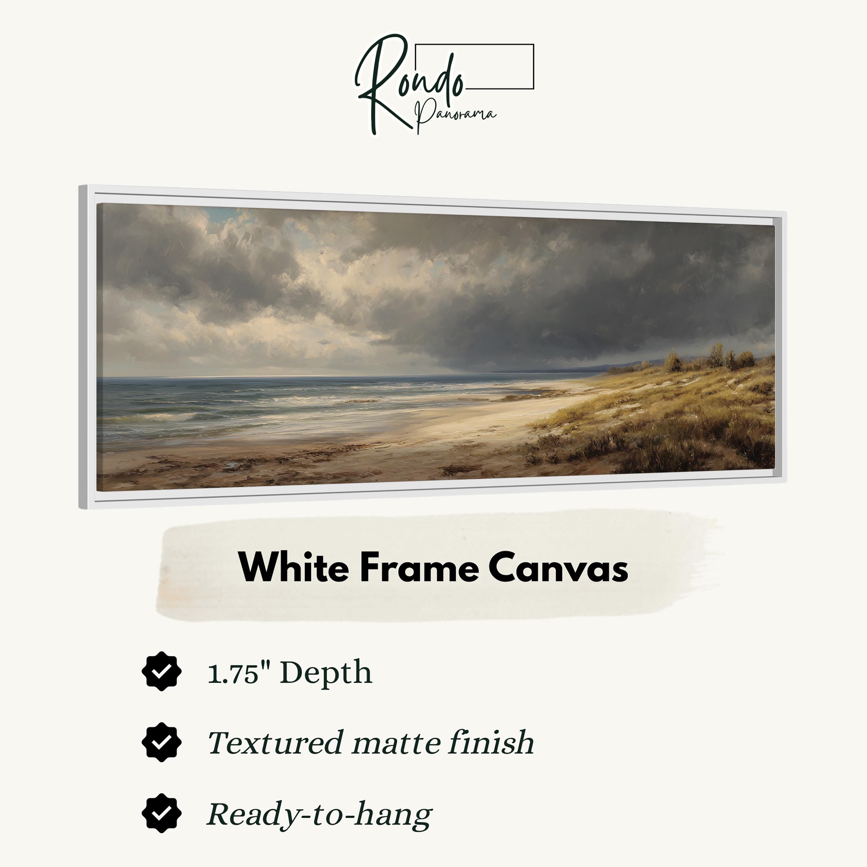 The image is a white frame canvas depicting a serene landscape with a beach and ocean.