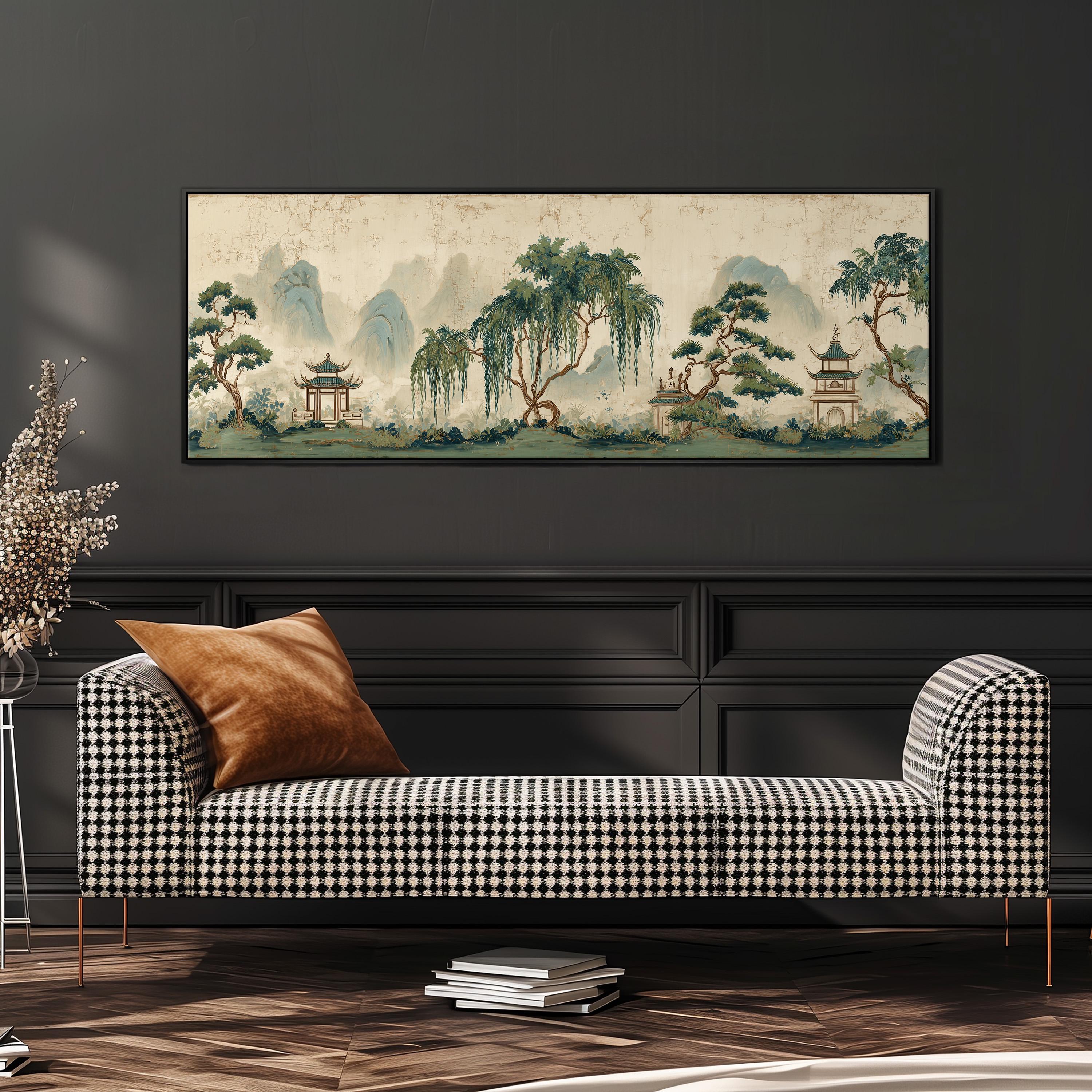 a large, framed painting of a serene landscape with mountains, trees, and pagodas hanging on a wall above a black and white checkered sofa.