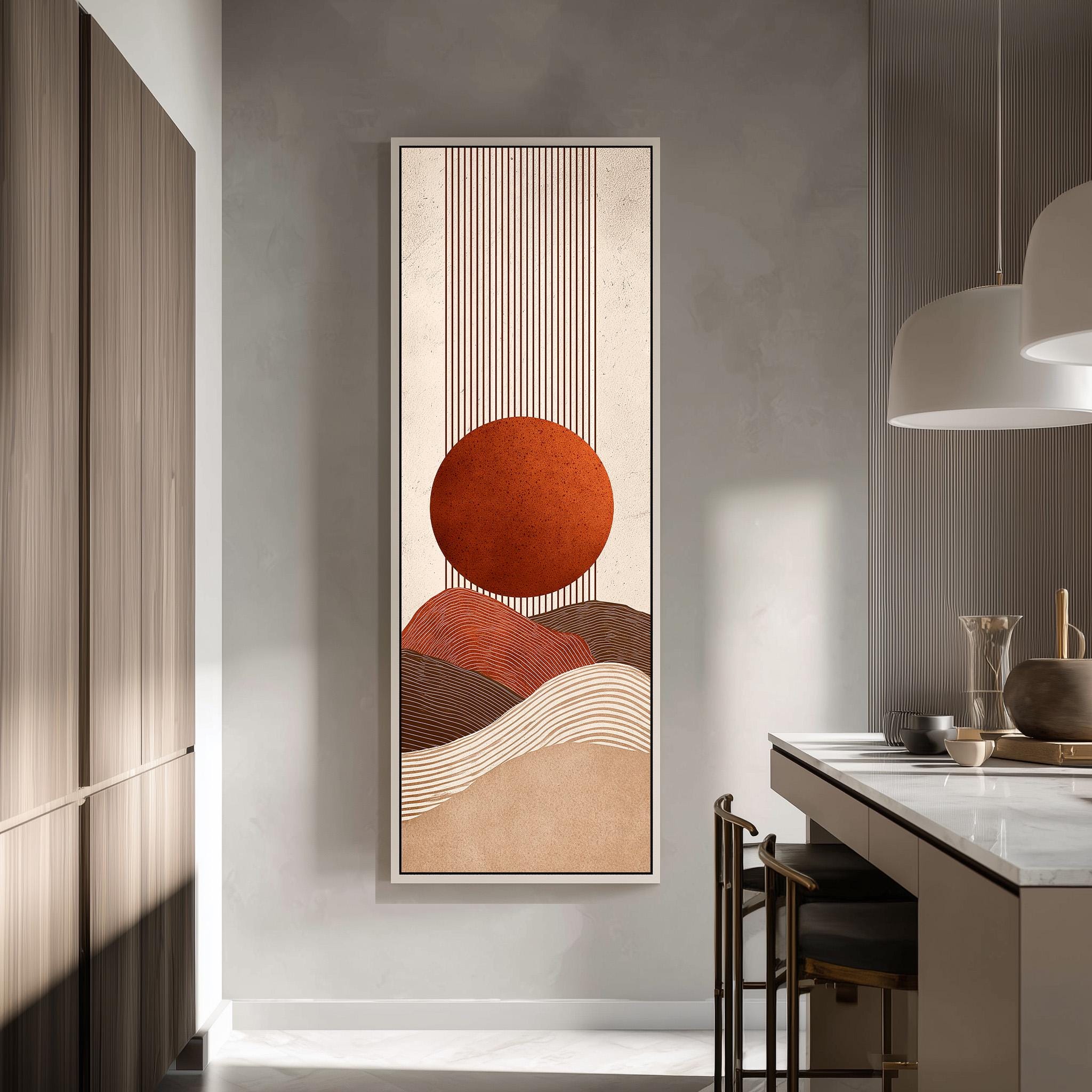 a modern kitchen with a large abstract painting hanging on the wall. The painting depicts a sun-like shape with a circular design in shades of orange and brown, set against a white background. The kitchen is equipped with a white countertop and a wooden cabinet, creating a clean and minimalist aesthetic.