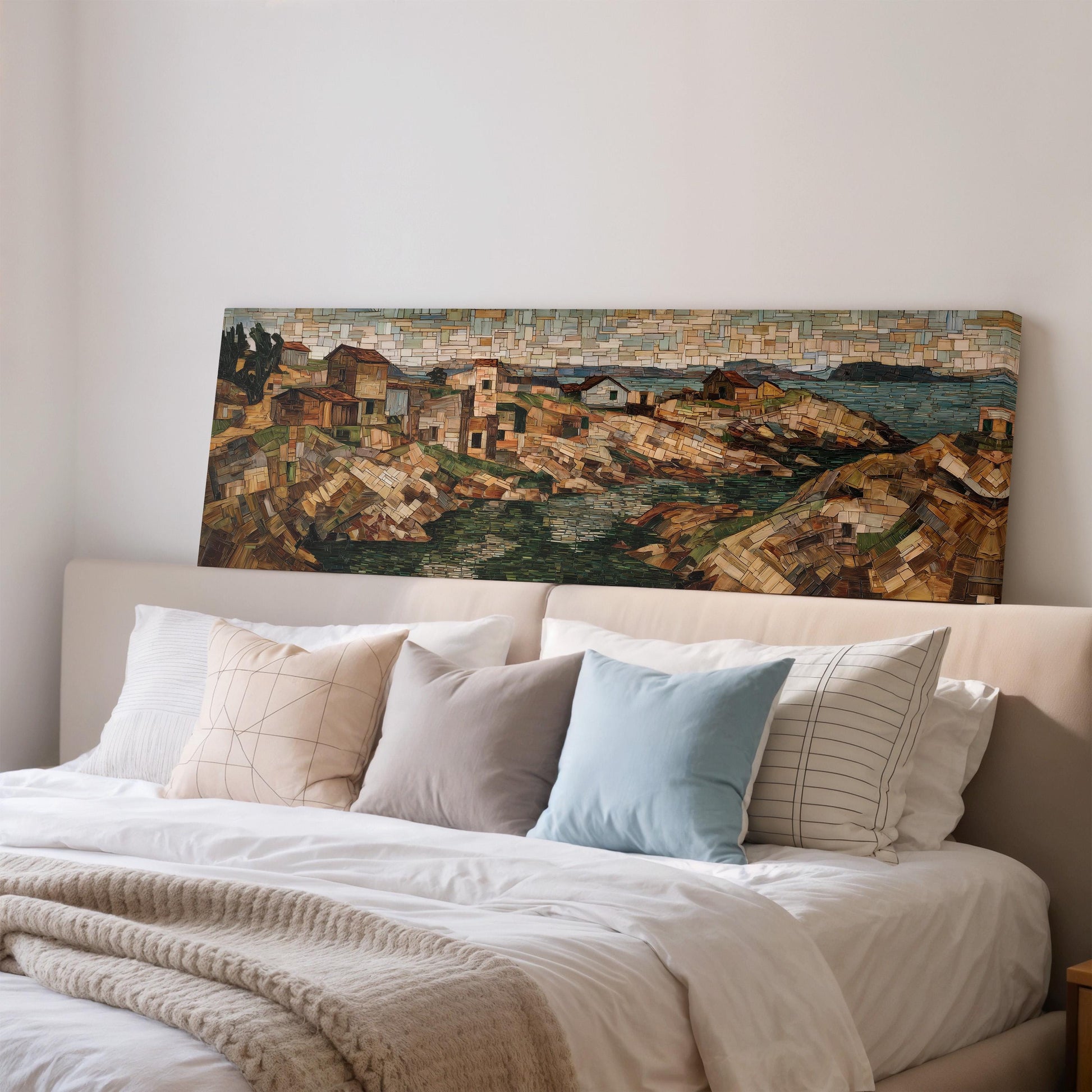 a large painting of a coastal town on the wall above a bed with white bedding and pillows.
