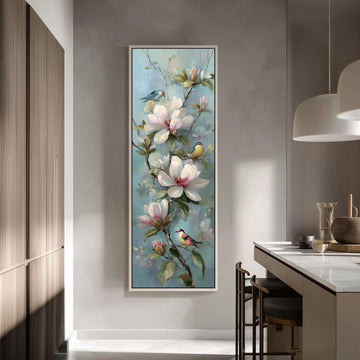 a large painting of a flower-filled branch hanging on a wall, with birds perched on the branches.