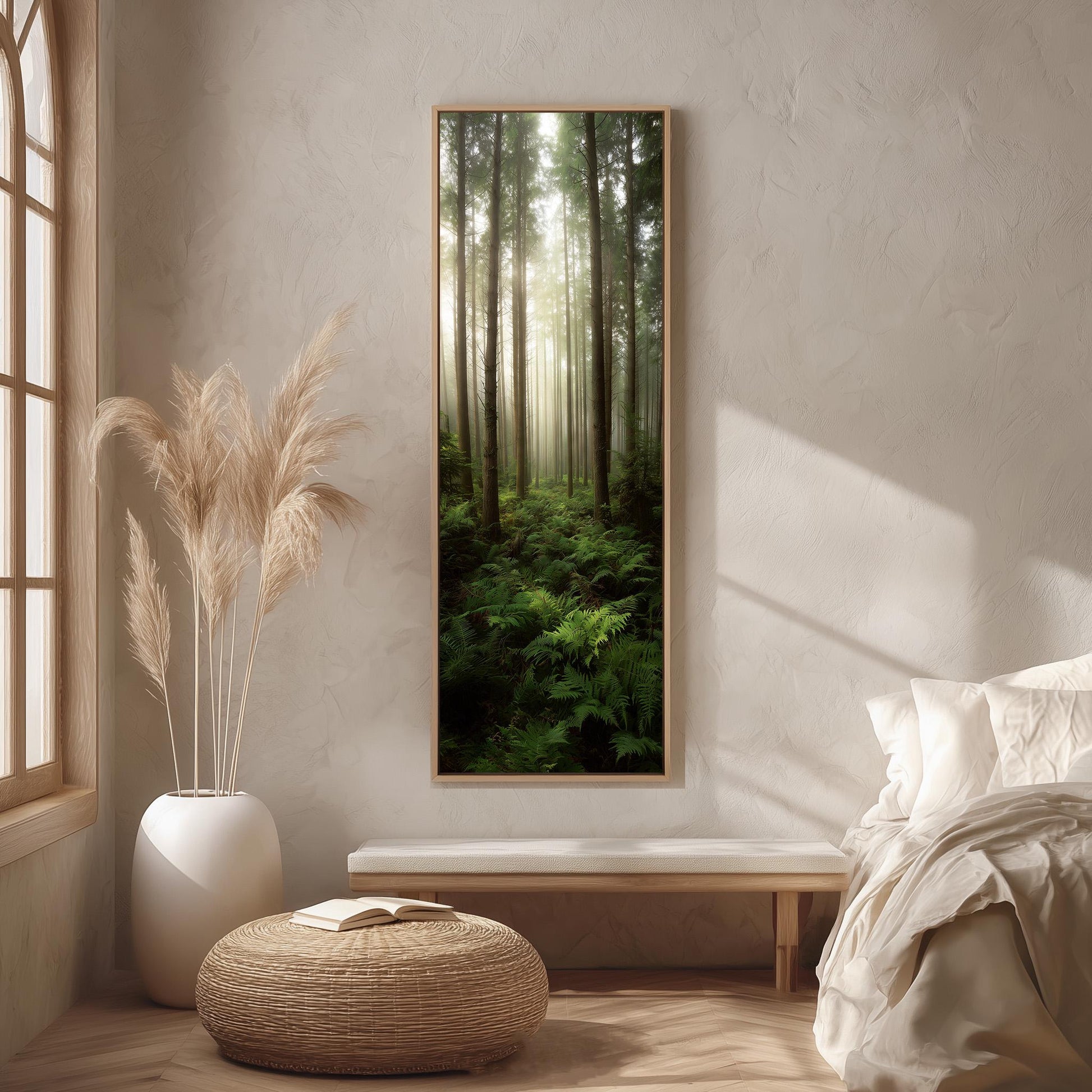 a serene bedroom scene with a large window overlooking a lush forest. The room features a bed with white bedding, a wicker ottoman, and a potted plant. A large framed picture of a forest is hanging on the wall, creating a calming and natural atmosphere in the space.