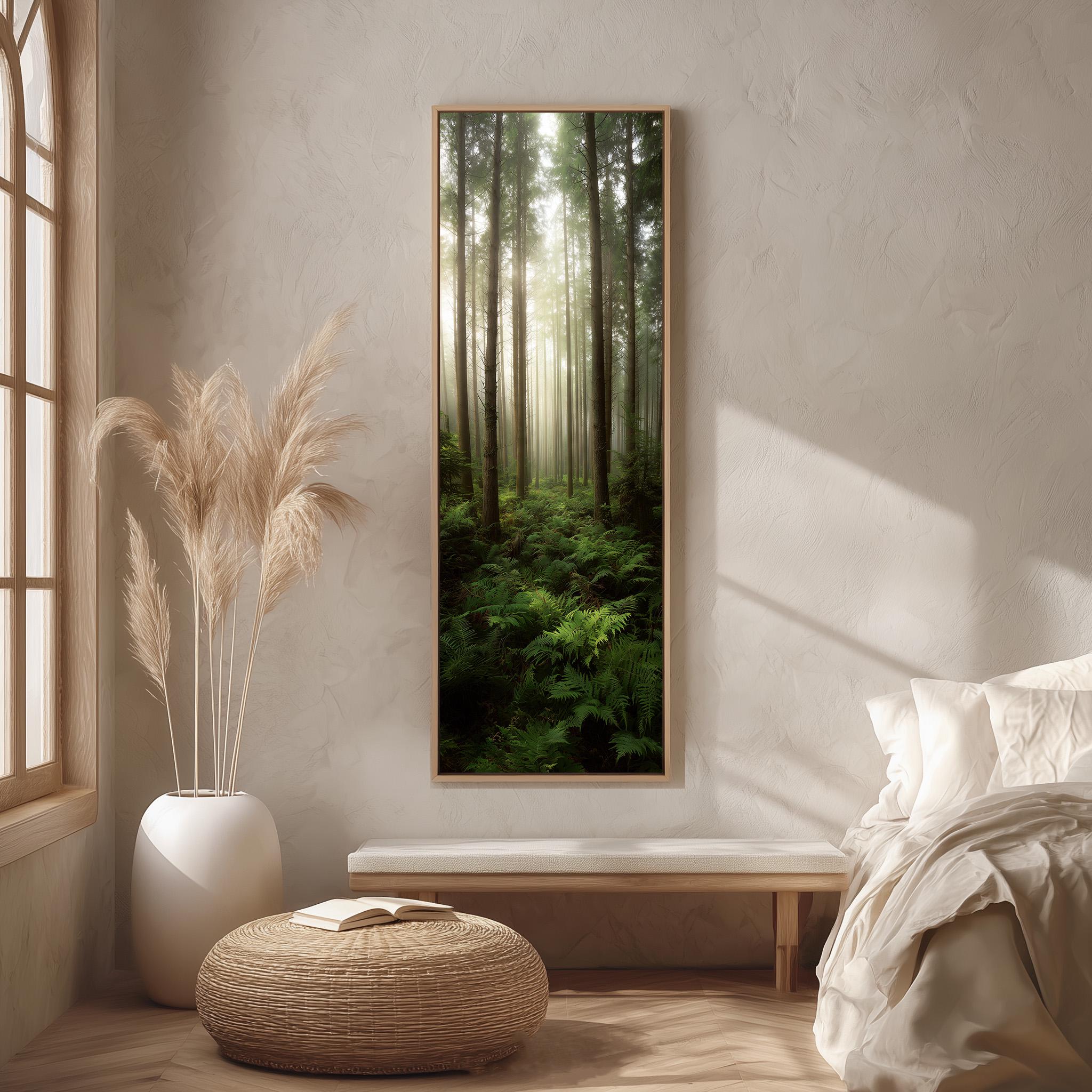 a serene bedroom scene with a large window overlooking a lush forest. The room features a bed with white bedding, a wicker ottoman, and a potted plant. A large framed picture of a forest is hanging on the wall, creating a calming and natural atmosphere in the space.