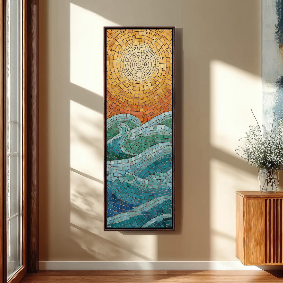 a large, colorful mosaic artwork depicting a sun and ocean scene, hanging on a wall in a room with a window and seating area.