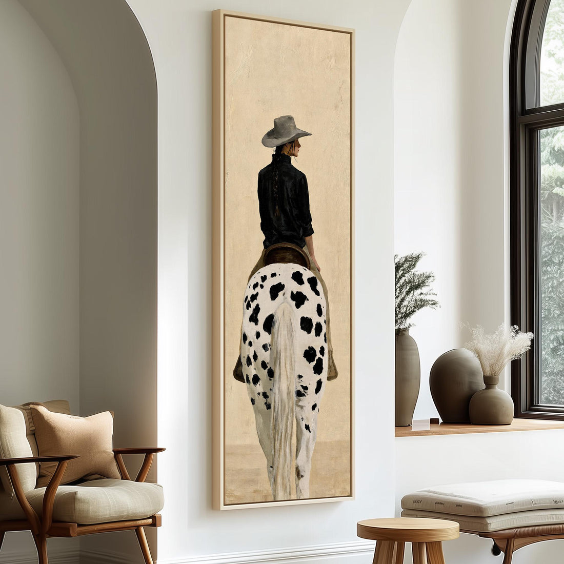 Cowgirl with a long braid on a spotted horse long vertical canvas print in a sunlit living space