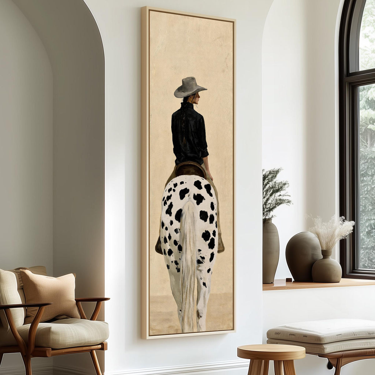 Cowgirl with a long braid on a spotted horse long vertical canvas print in a sunlit living space