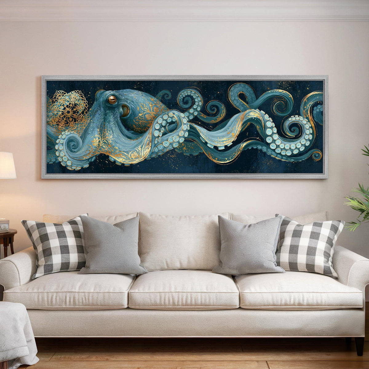 Blue and gold octopus panoramic canvas print above a white sofa in a bright living room