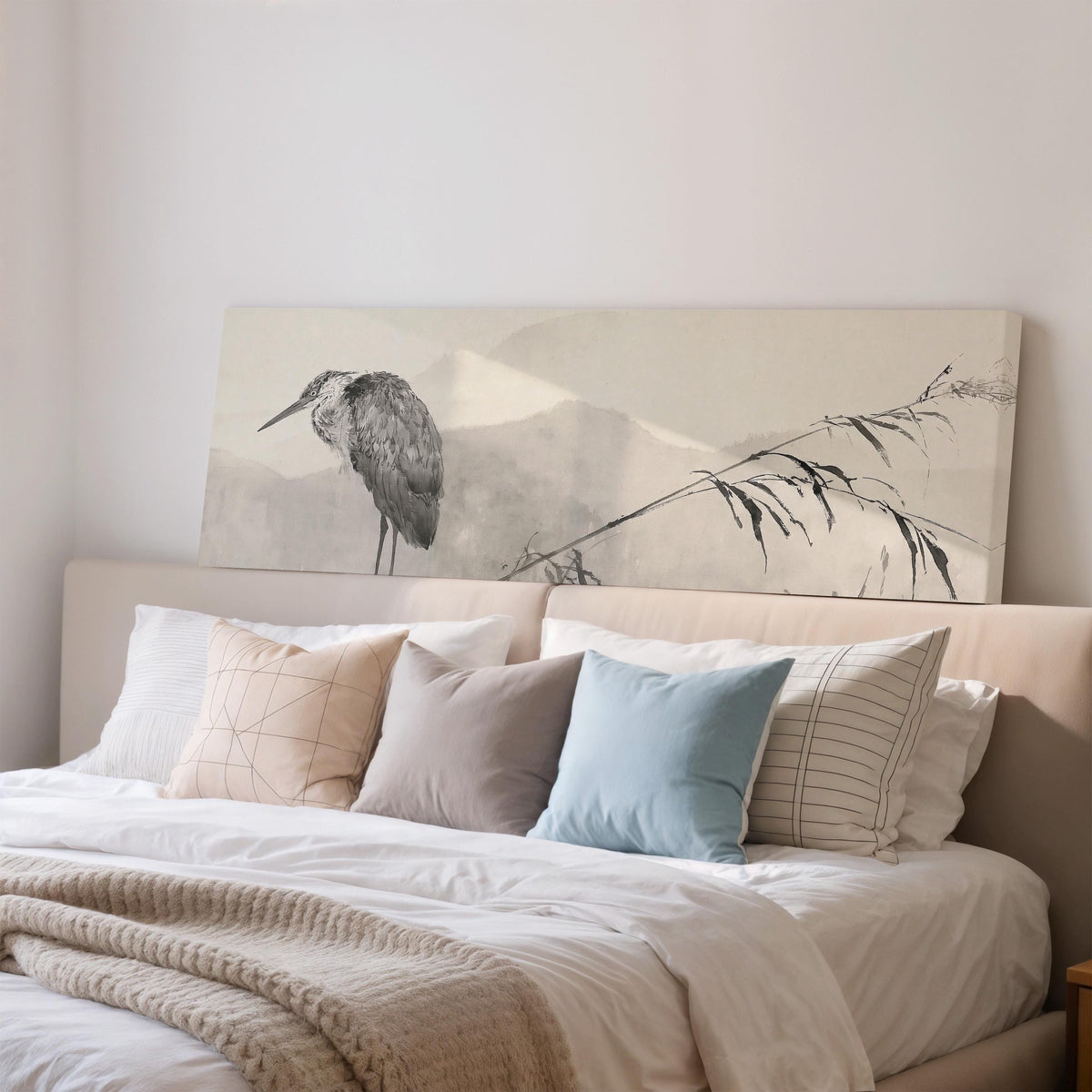 Heron in front of misty ink mountains wide panoramic canvas print above a bed in a bedroom