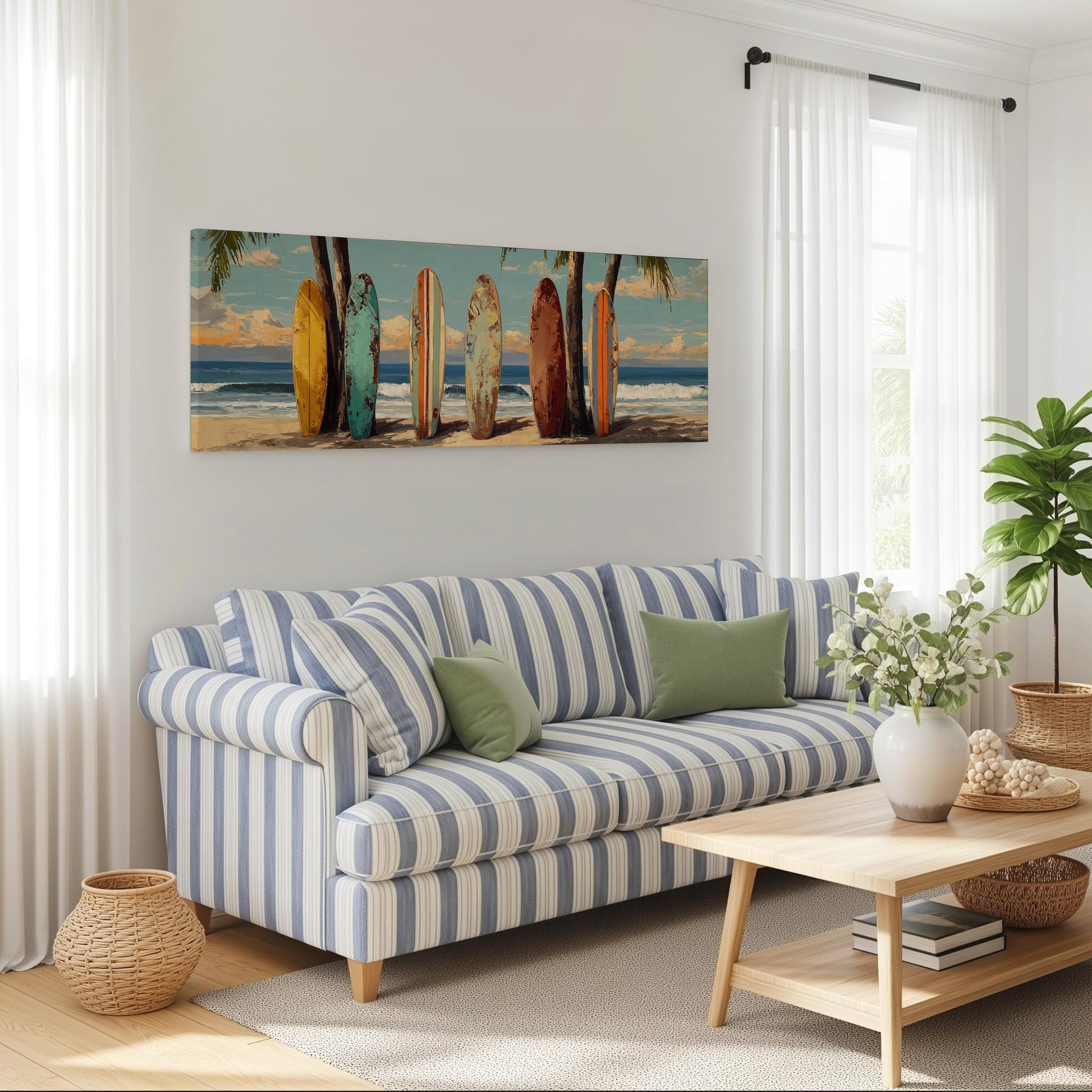 a living room with a blue and white striped sofa, a coffee table, and a large wall art depicting a beach scene with surfboards.