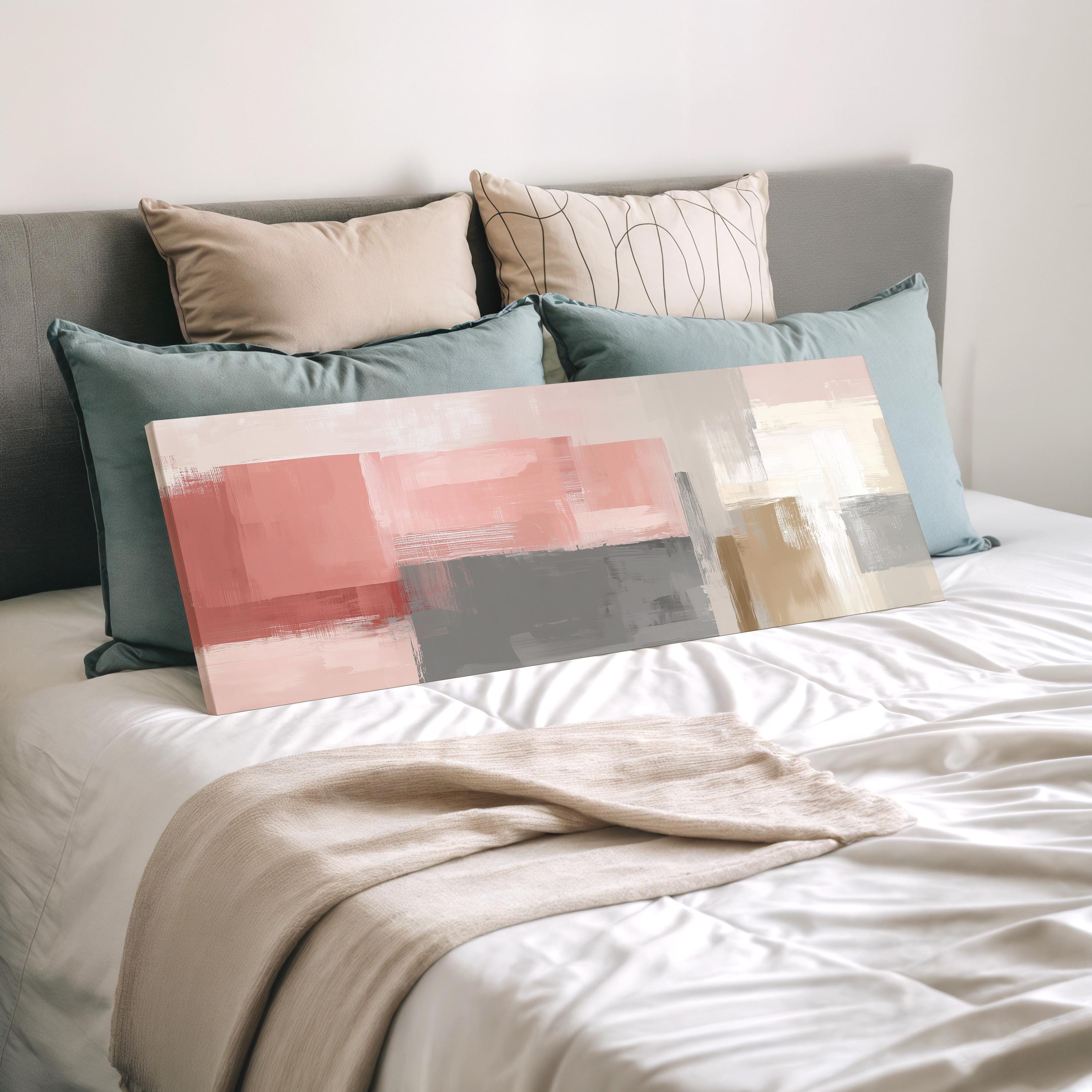 a bedroom with a bed covered in white sheets and a large abstract painting resting on top of the bed.