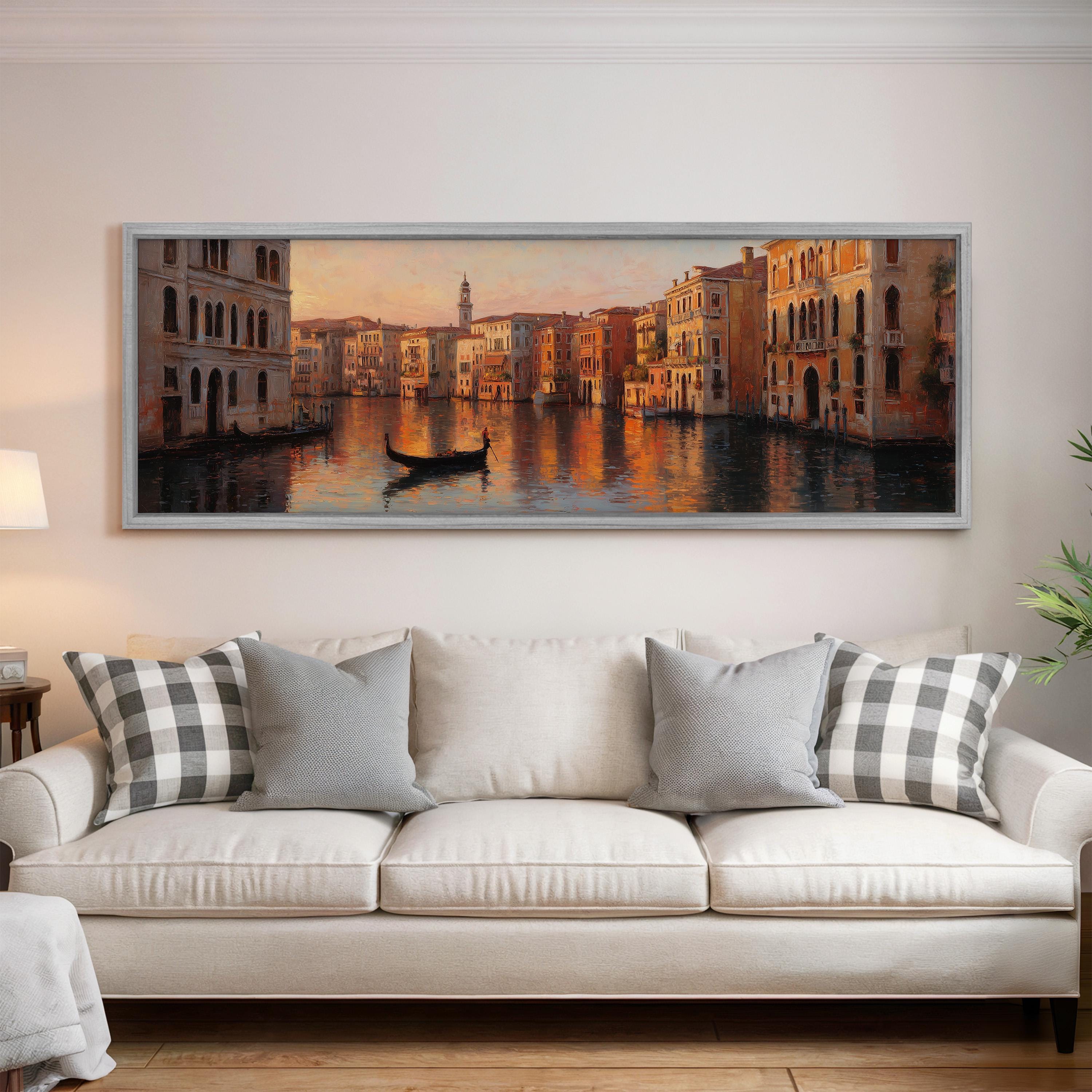 a large painting of a cityscape with a gondola in the foreground, hanging on a wall above a white sofa with patterned throw pillows.