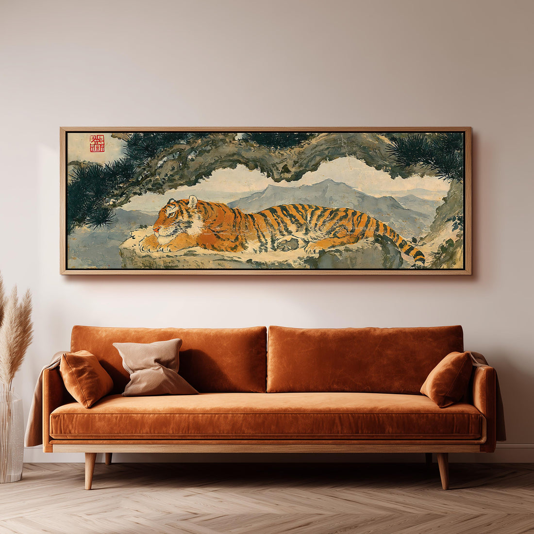 Tiger resting beneath misty pines long horizontal canvas print above a sofa in a living room