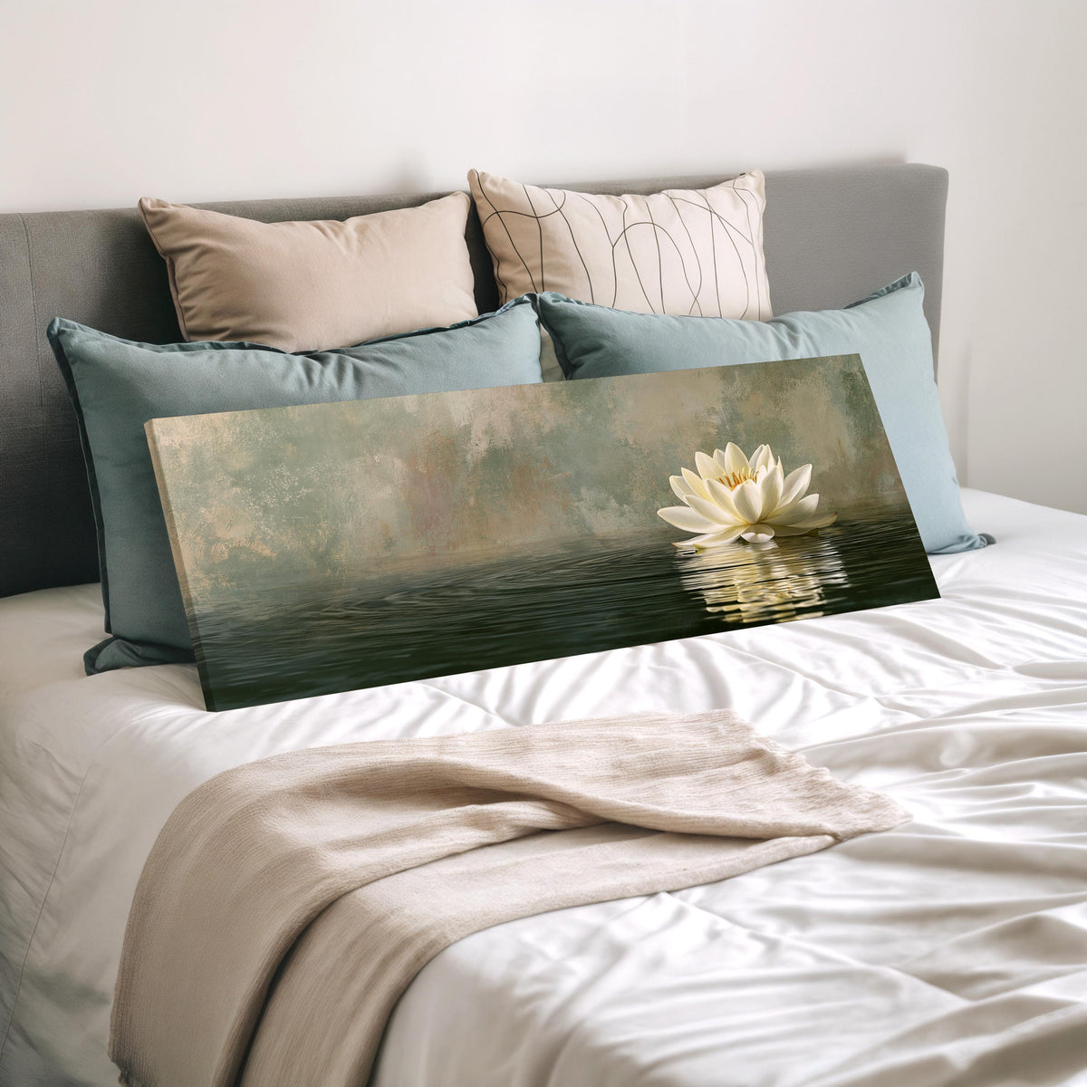 White water lily in soft mist wide panoramic canvas print laid on a bed to show its size