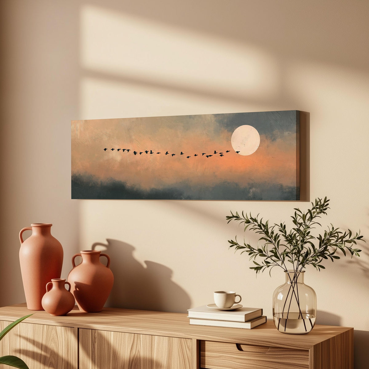 Geese flying toward the moon at twilight long horizontal canvas print above a wooden sideboard