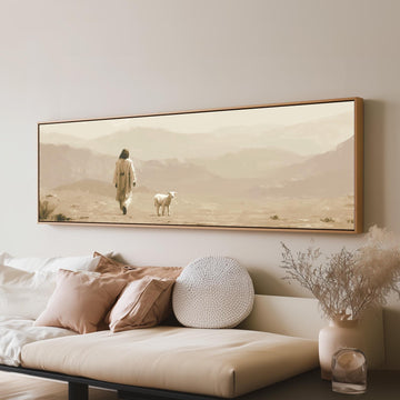 Jesus walking with a lamb through the desert long horizontal canvas print above a sofa in a living room