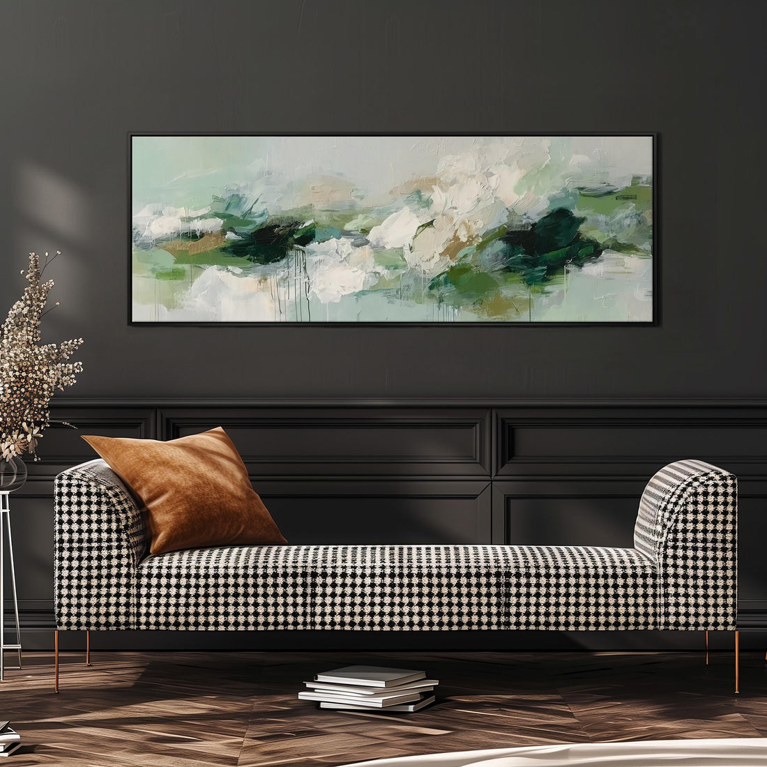 a large, rectangular painting hanging on a wall above a brown sofa with orange cushions.