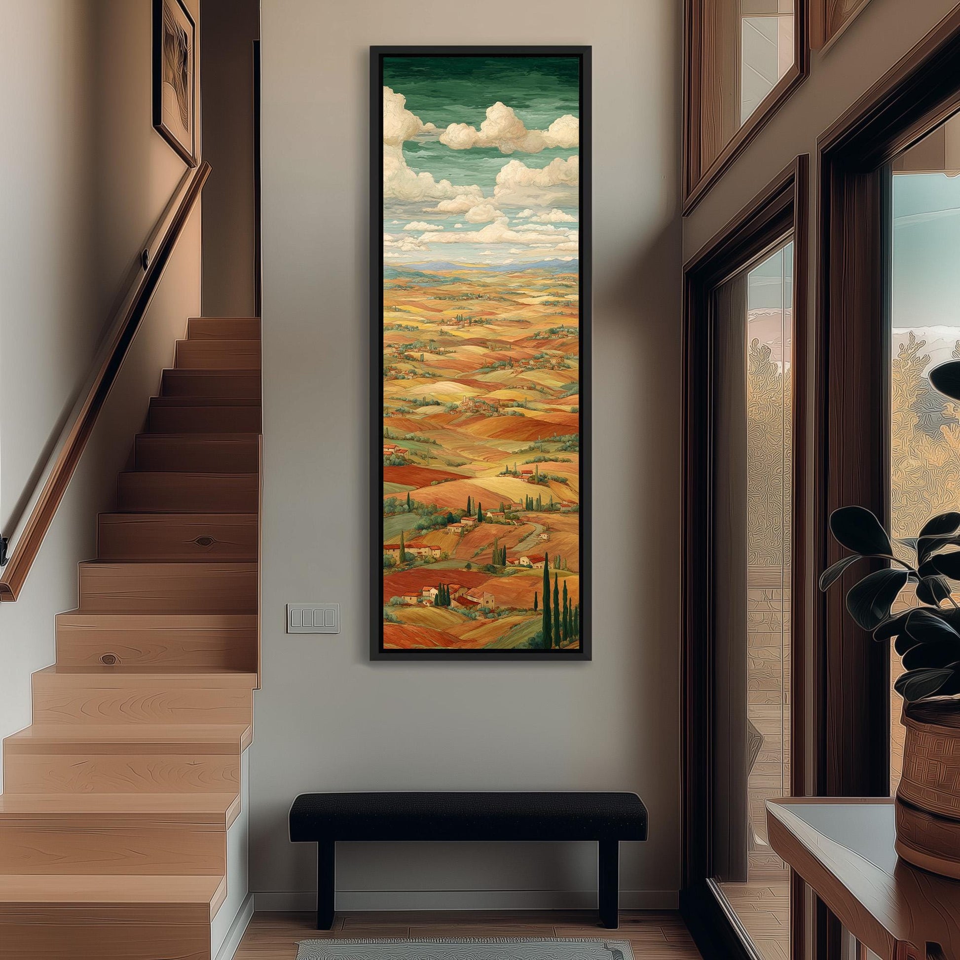 a large, colorful painting of a countryside landscape hanging on the wall of a hallway. The painting depicts rolling hills, trees, and a cloudy sky, creating a serene and picturesque scene. The hallway is well-lit, with a staircase leading up to the painting, and a bench is placed in front of it. The overall atmosphere of the image is calm and inviting, with the painting serving as a focal point in the space.
