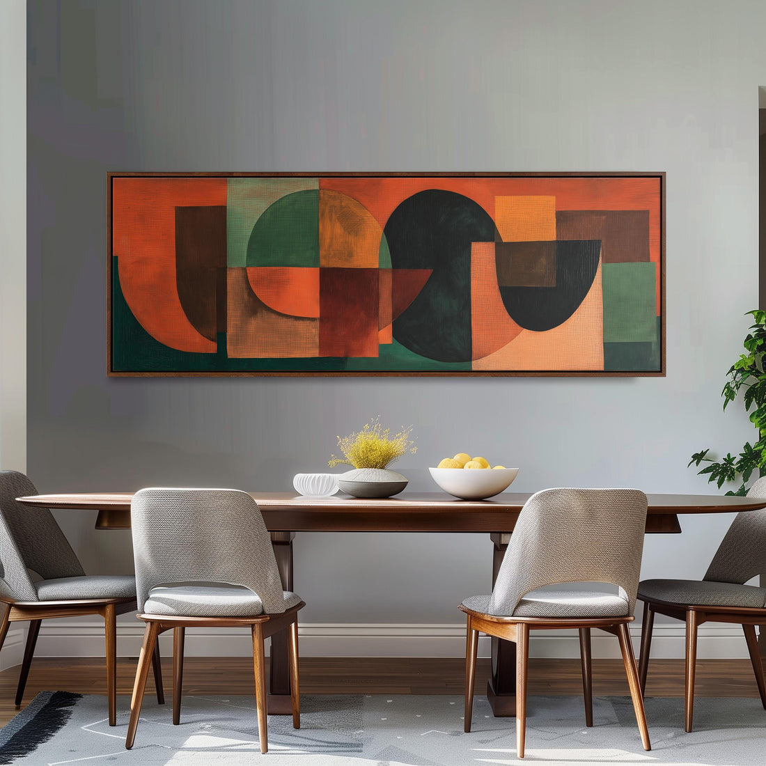 a large abstract painting hanging on a wall above a brown sofa with two pillows.