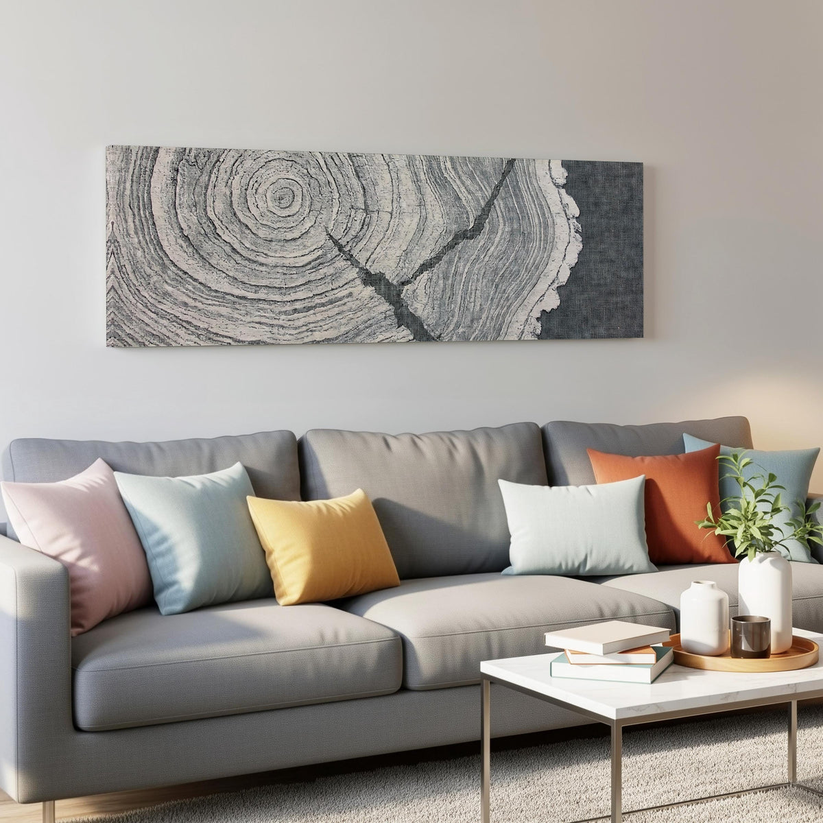 Grey tree ring on linen texture panoramic canvas print above a grey sofa in a living room
