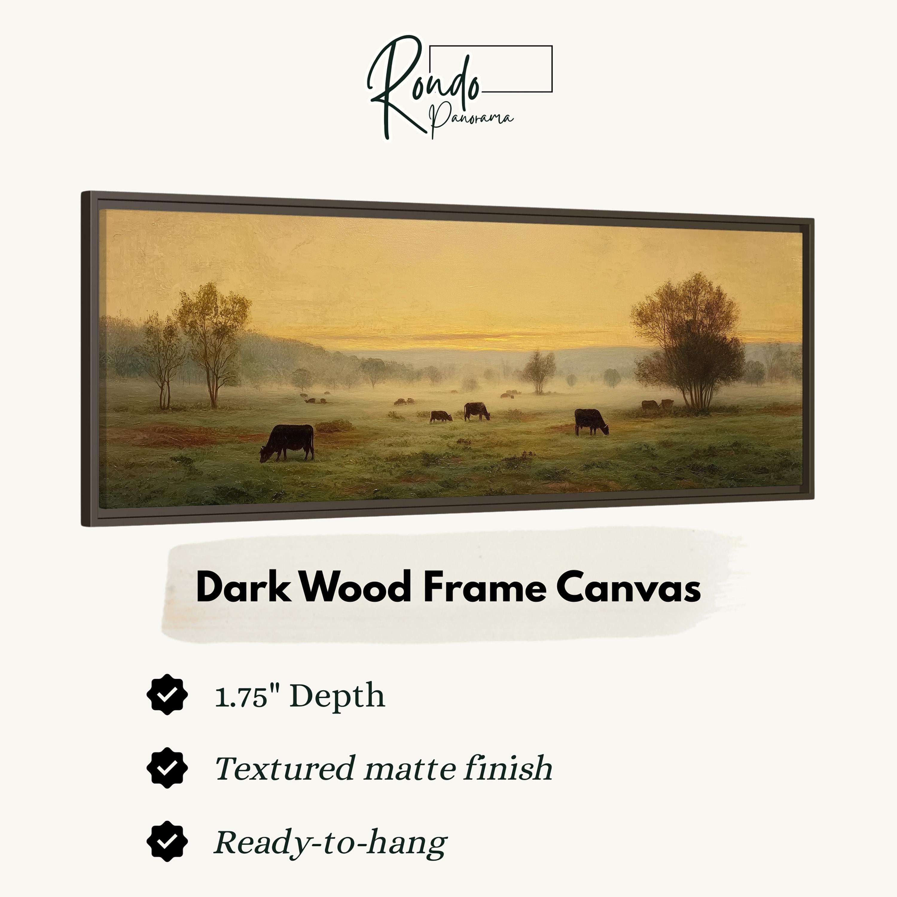 The image is a painting of a pastoral scene with cows grazing in a field. The painting is framed in a dark wood frame and is described as a "Dark Wood Frame Canvas" with a 1.75" depth, a textured matte finish, and a ready-to-hang condition.