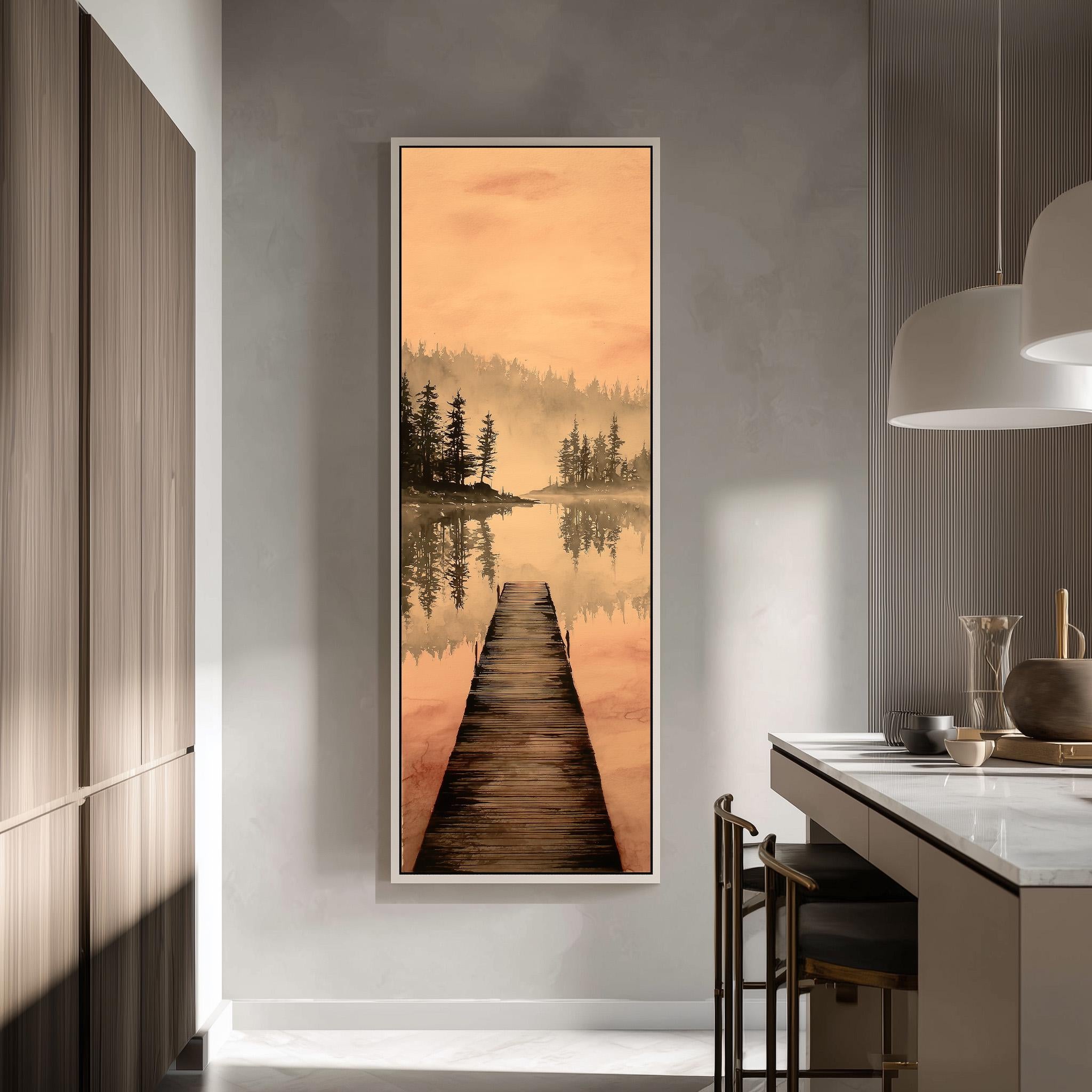 a large framed painting of a wooden dock leading to a serene lake, with a forested area in the background. The painting is hung on a wall in a modern kitchen with a countertop and chairs.
