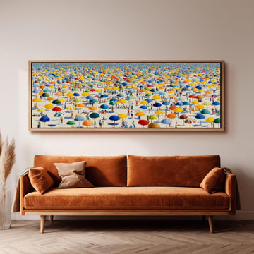 a large, colorful painting of a beach scene with numerous umbrellas and people enjoying the sunny day.