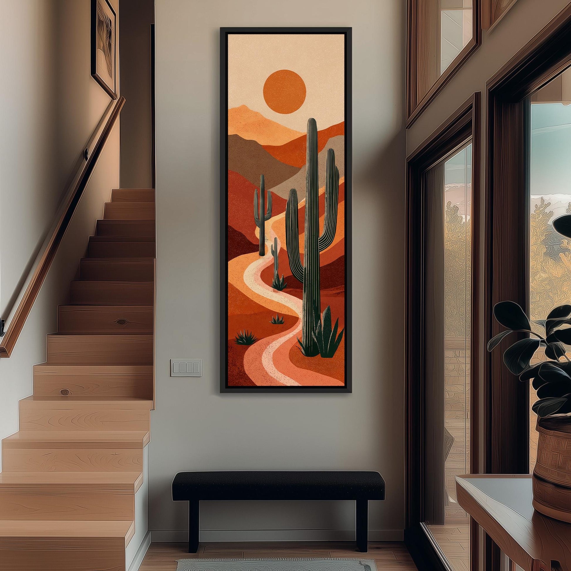 a hallway with a large painting of a desert landscape hanging on the wall. The painting depicts a winding path surrounded by cacti and mountains, creating a serene and natural atmosphere.
