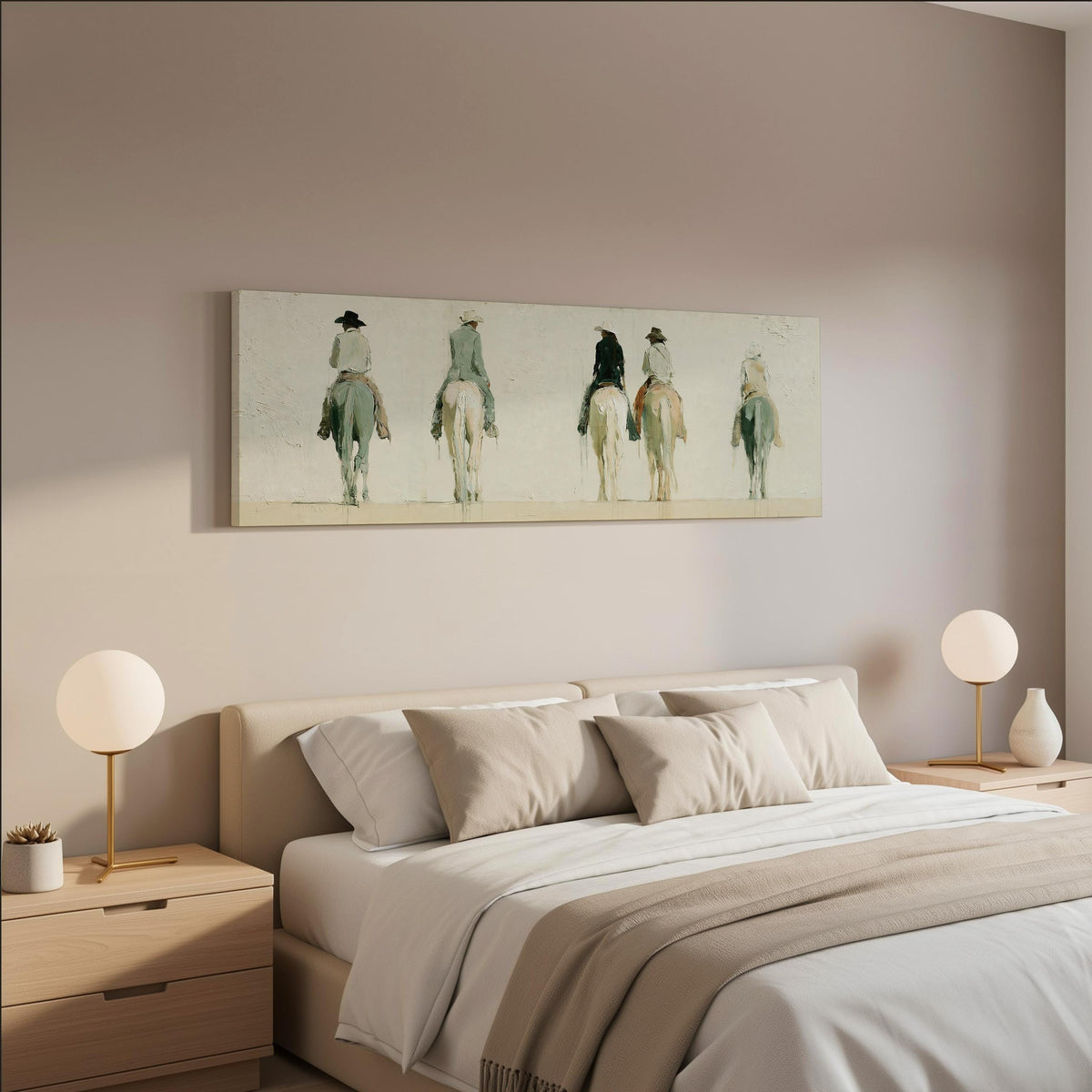 Riders on horseback seen from behind wide panoramic canvas print above a bed in a neutral bedroom