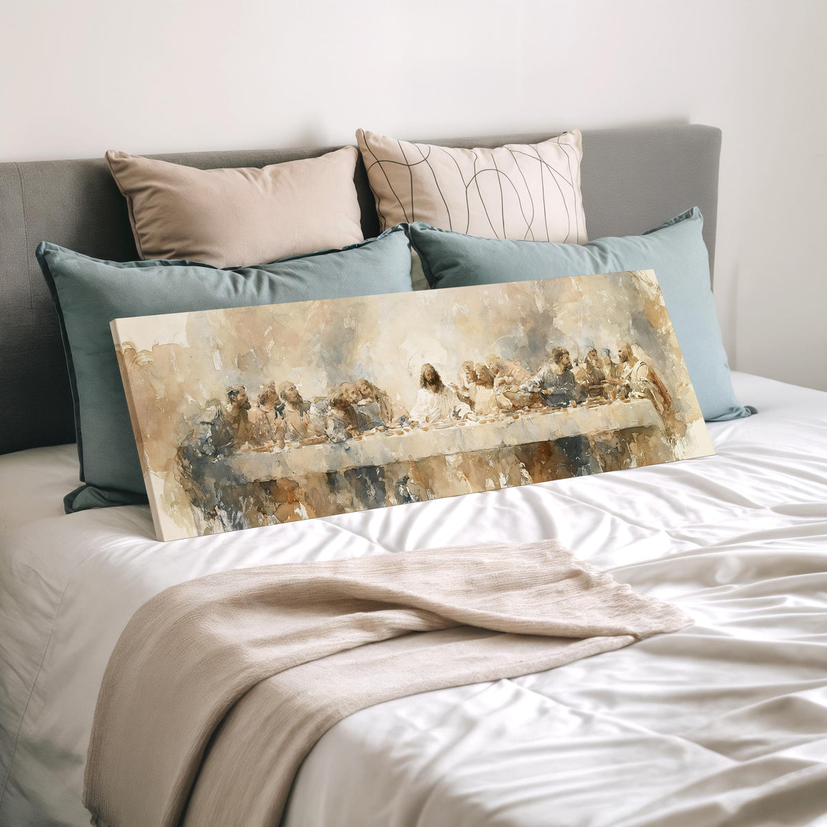 The Last Supper in soft gold tones wide panoramic canvas print laid on a bed to show its size