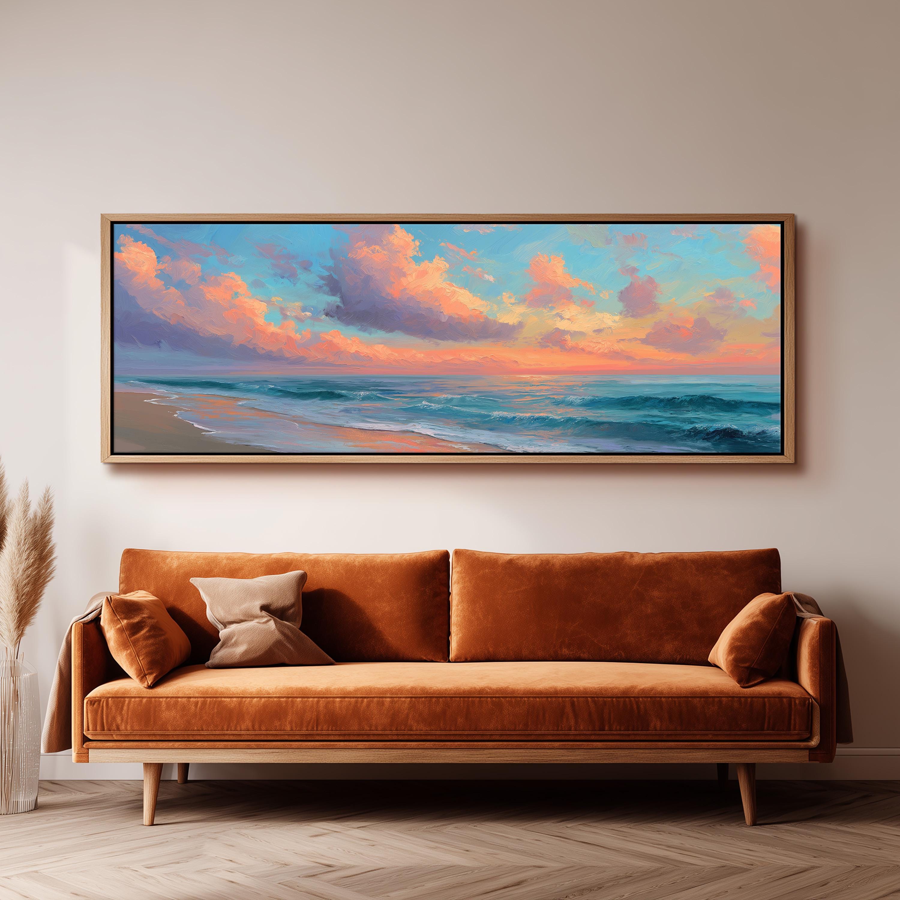 a large, framed painting of a beach scene hanging on a wall above a brown sofa.