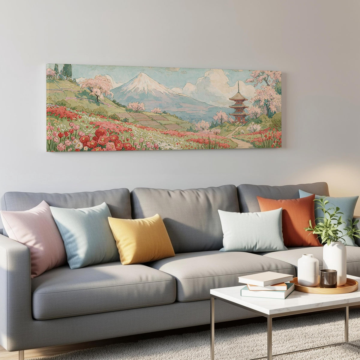 Mount Fuji with sakura and a pagoda panoramic canvas print above a grey sofa in a living room