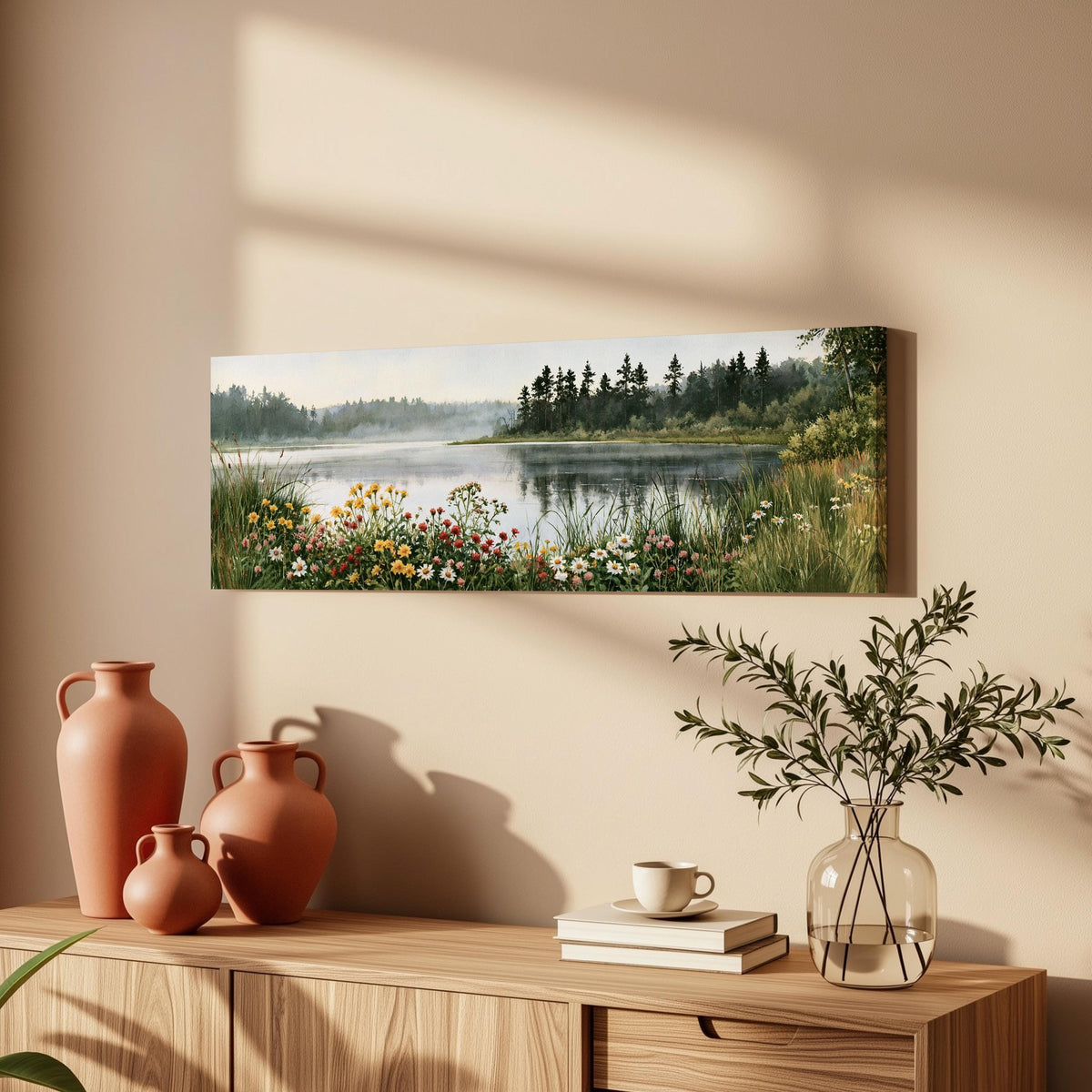 Lake with wildflowers on the shore long horizontal canvas print above a wooden sideboard