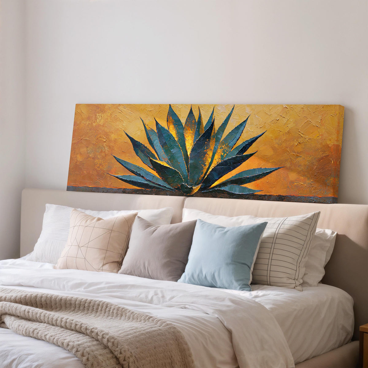 Blue agave on a textured gold background wide panoramic canvas print above a bed in a bedroom