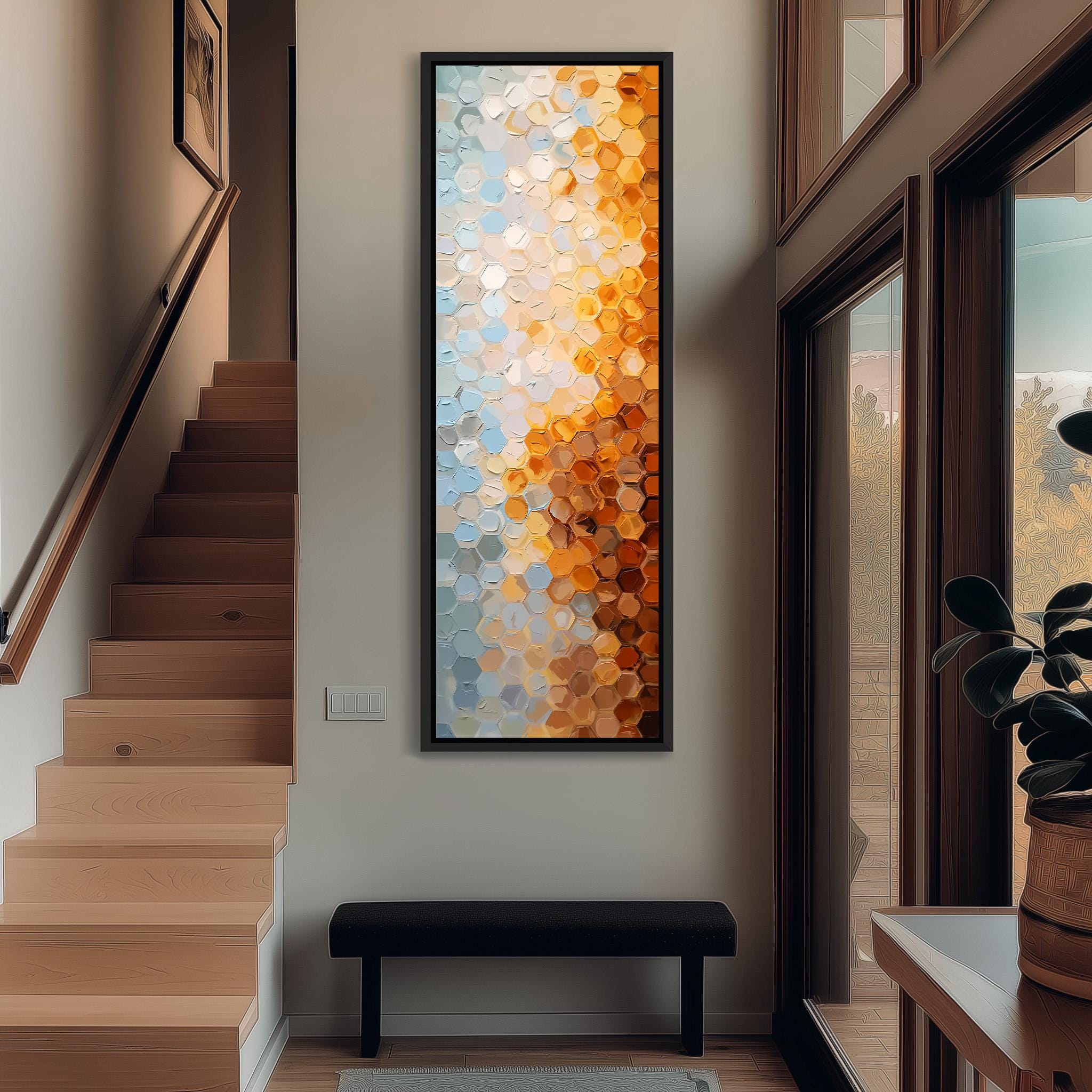 a modern hallway with a large abstract painting hanging on the wall, a wooden staircase, and a black bench.