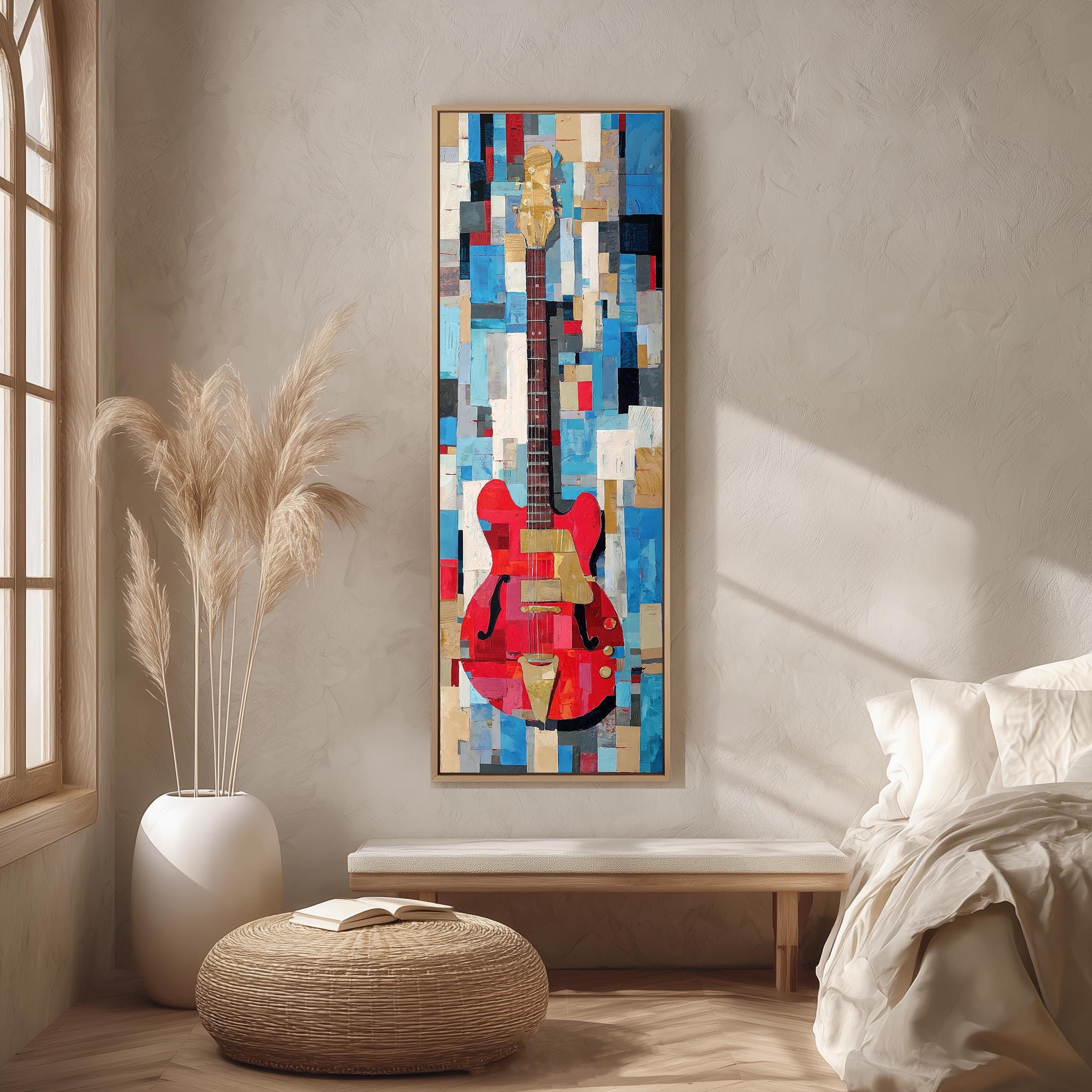 a large abstract painting of a guitar hanging on a wall in a room with a bed, a wicker ottoman, and a potted plant.