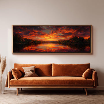 a large, framed painting of a sunset landscape hanging on a wall above a brown sofa.