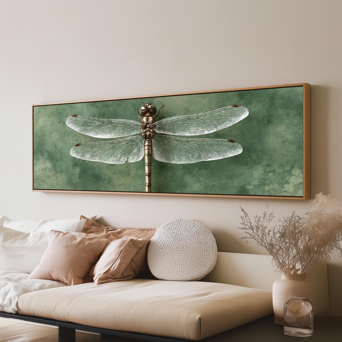 Dragonfly illustration on sage long horizontal canvas print above a sofa in a living room