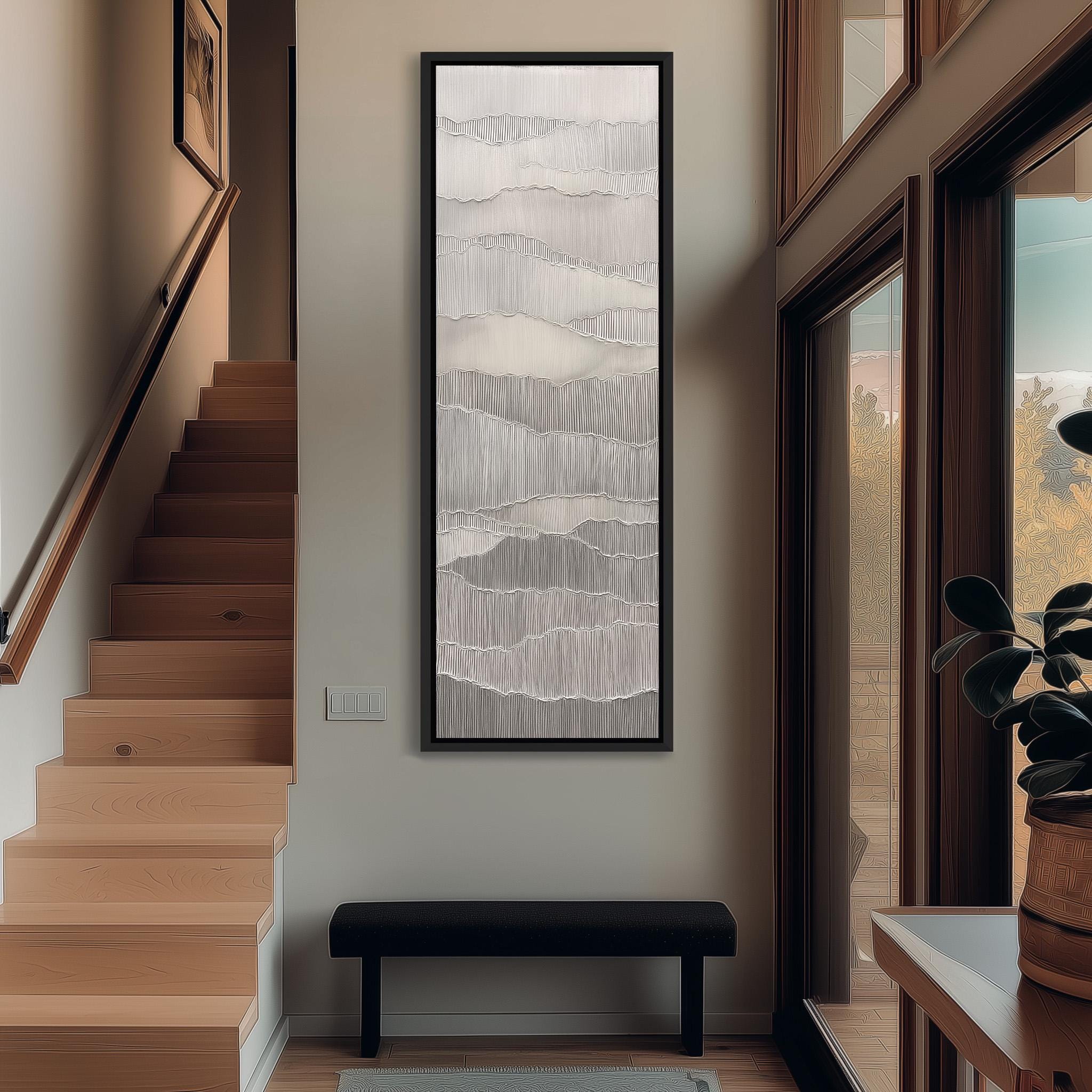 a modern and minimalist interior design, featuring a large abstract painting hanging on the wall, a wooden staircase, a black bench, and a large window that allows natural light to enter the space.