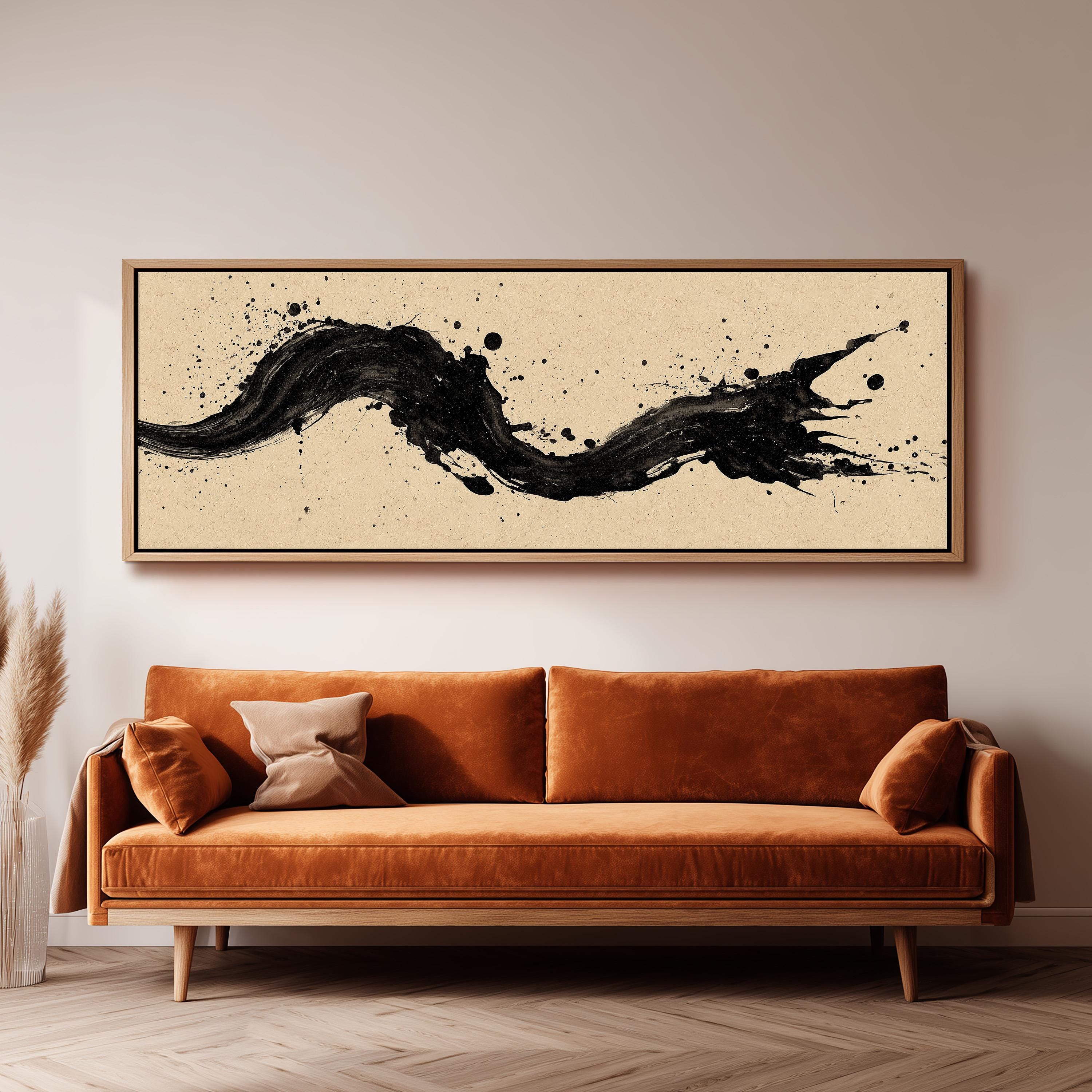 a large, abstract painting hanging on a wall above a brown sofa with orange cushions.