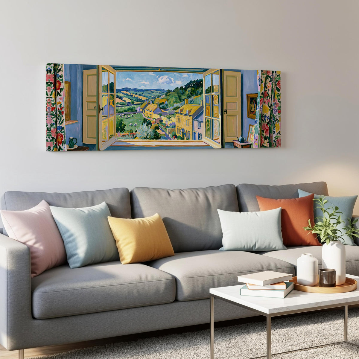 English countryside village through a window panoramic canvas print above a grey sofa in a living room