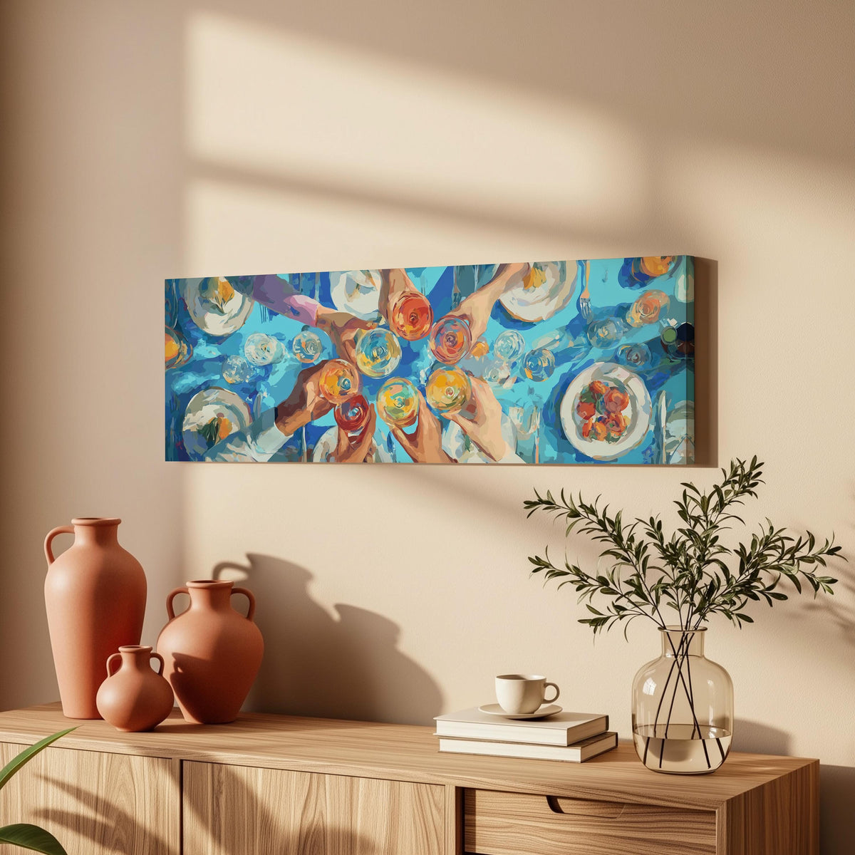 Friends toasting over a blue table from above long horizontal canvas print above a wooden sideboard
