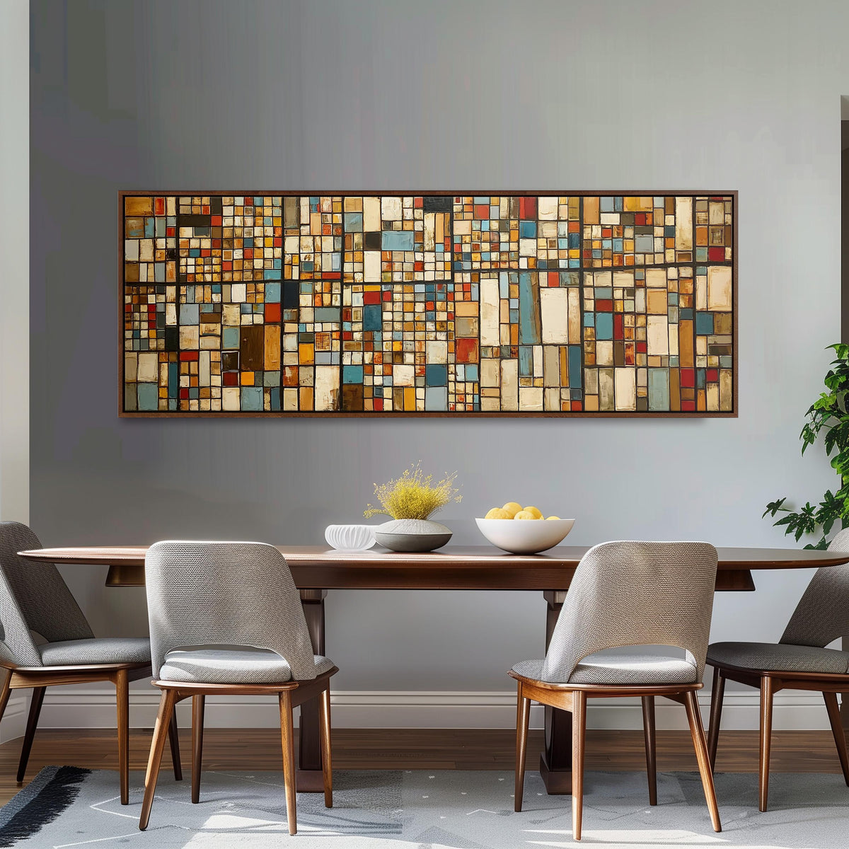 Earth tone mosaic grid in blue and ochre long horizontal canvas print above a dining table