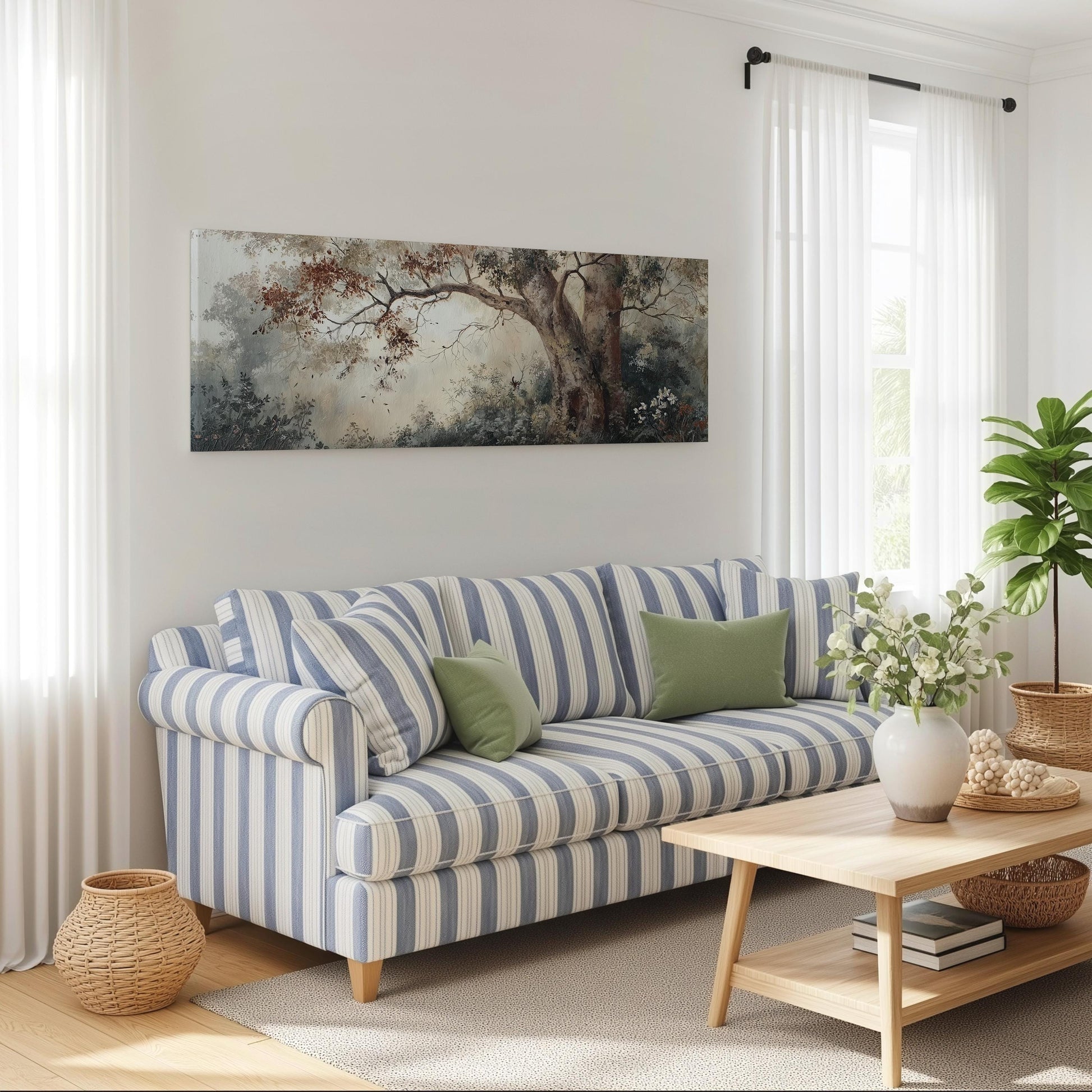a cozy living room with a striped blue and white sofa, a wooden coffee table, and a large painting of a tree hanging on the wall.