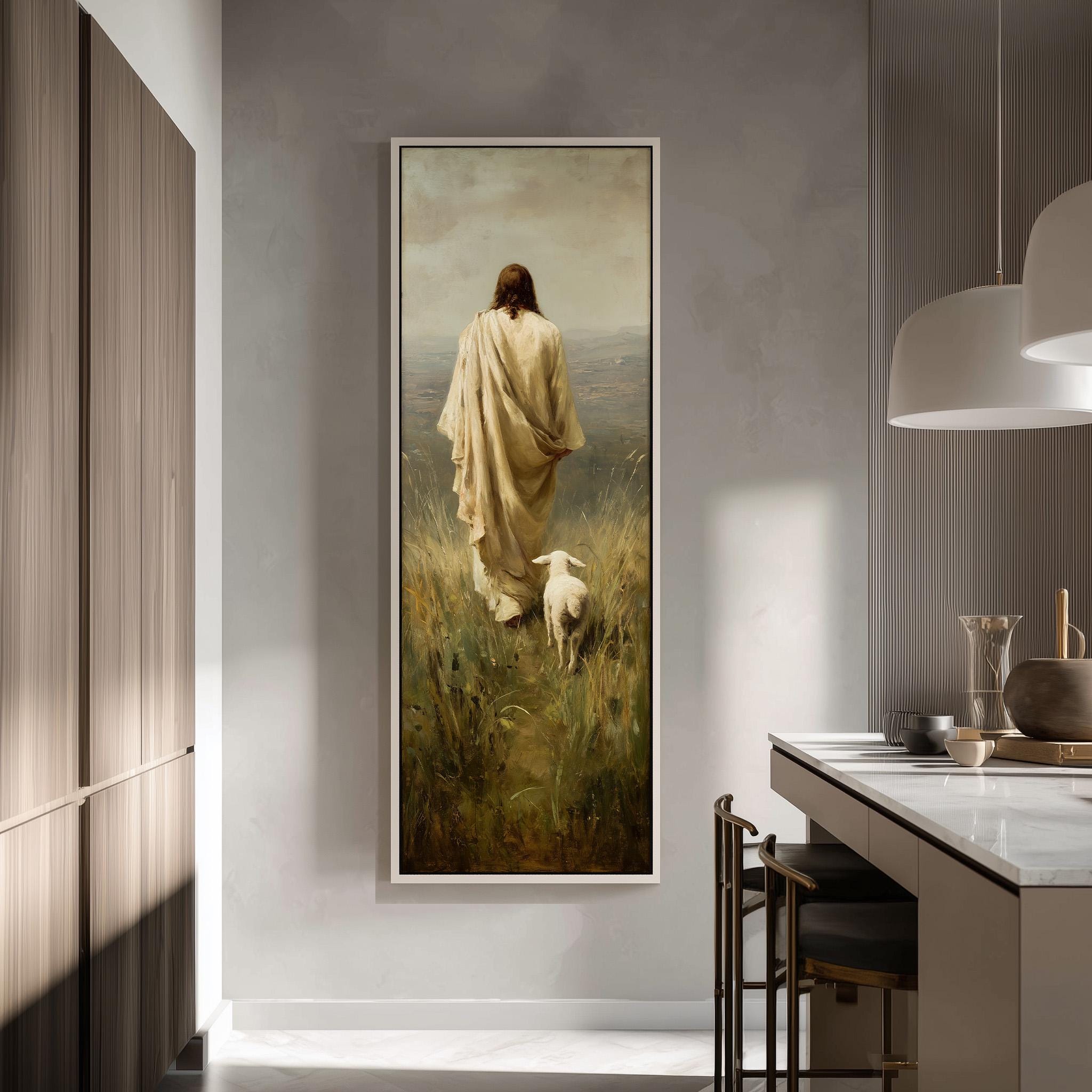 a large painting of a person in a robe walking through a field with a sheep, hanging on a wall in a modern kitchen.