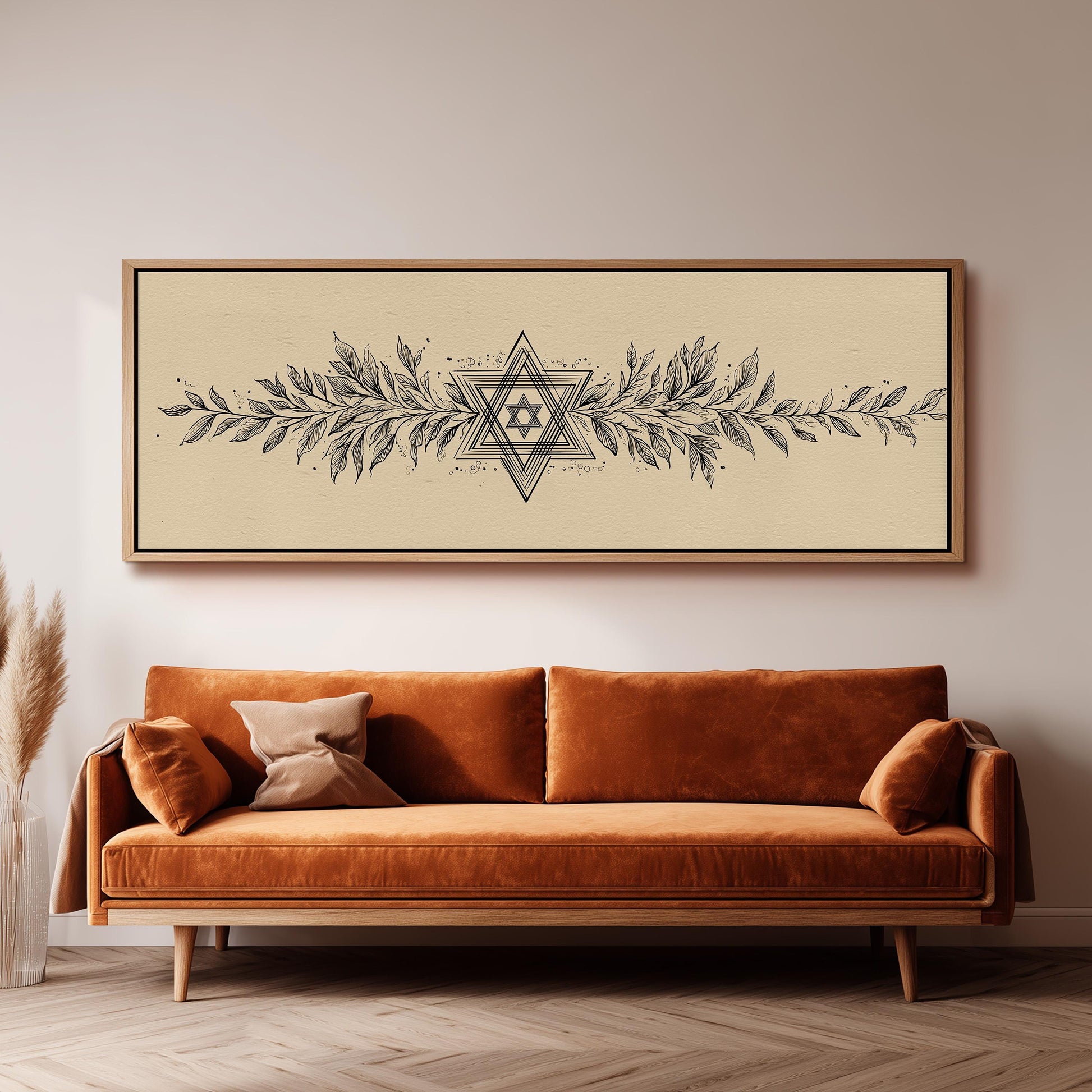 a large, ornate, and detailed painting of a star above a brown sofa with decorative pillows.