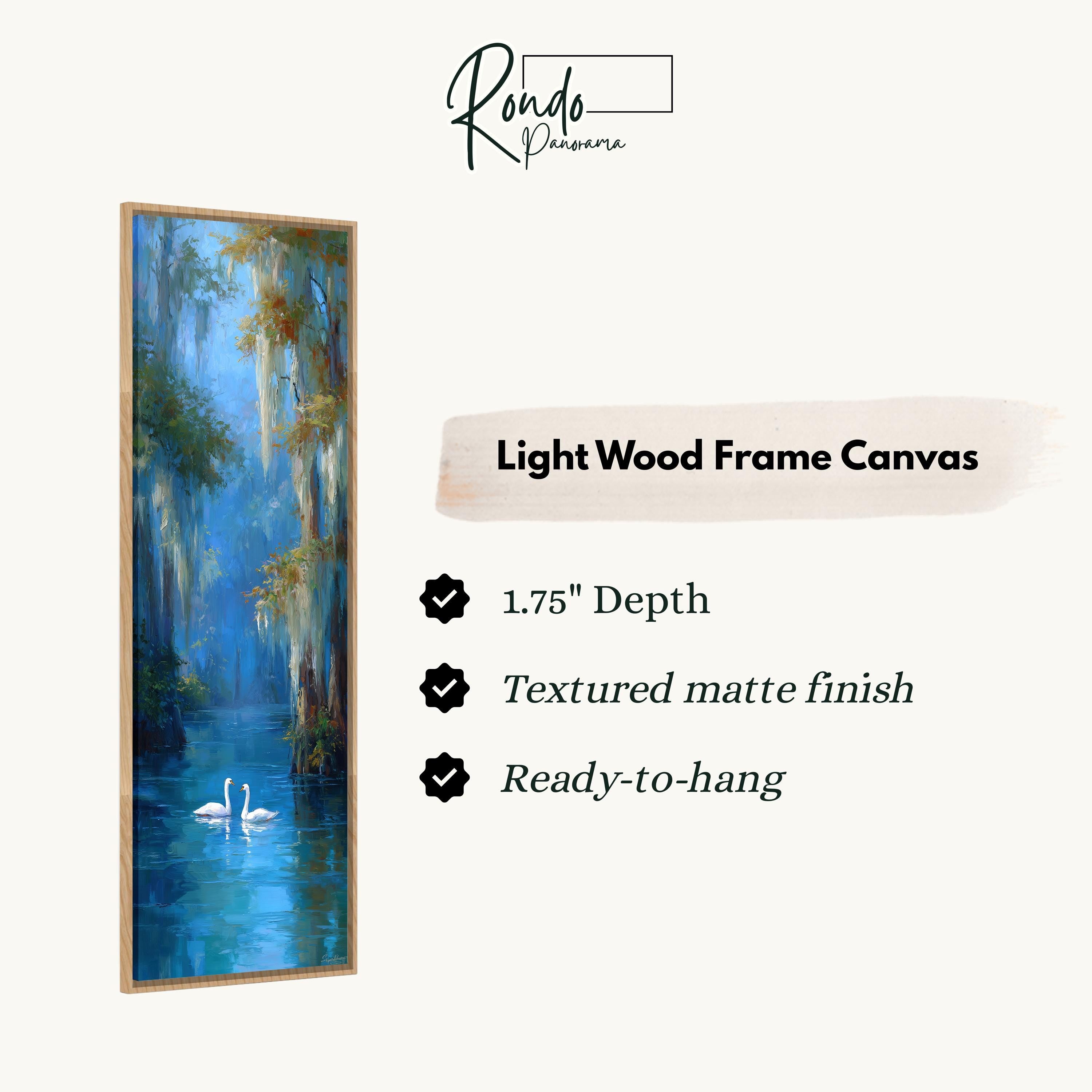 The image is a light wood frame canvas depicting a serene scene of swans swimming in a pond.
