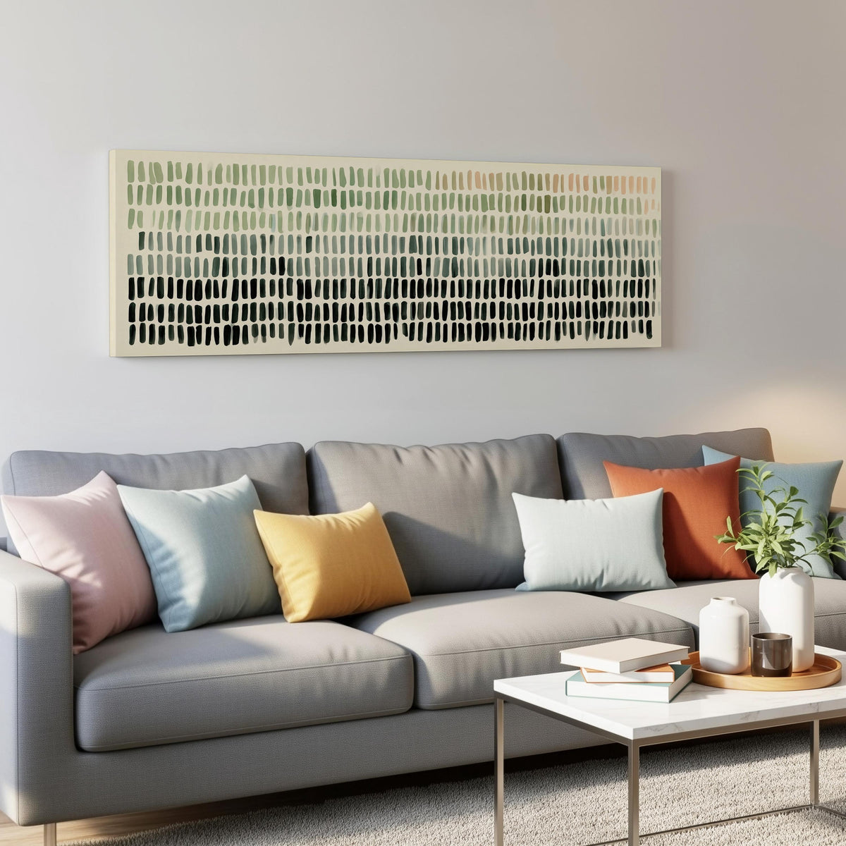 Brushmark dashes fading from sage to charcoal panoramic canvas print above a grey sofa in a living room